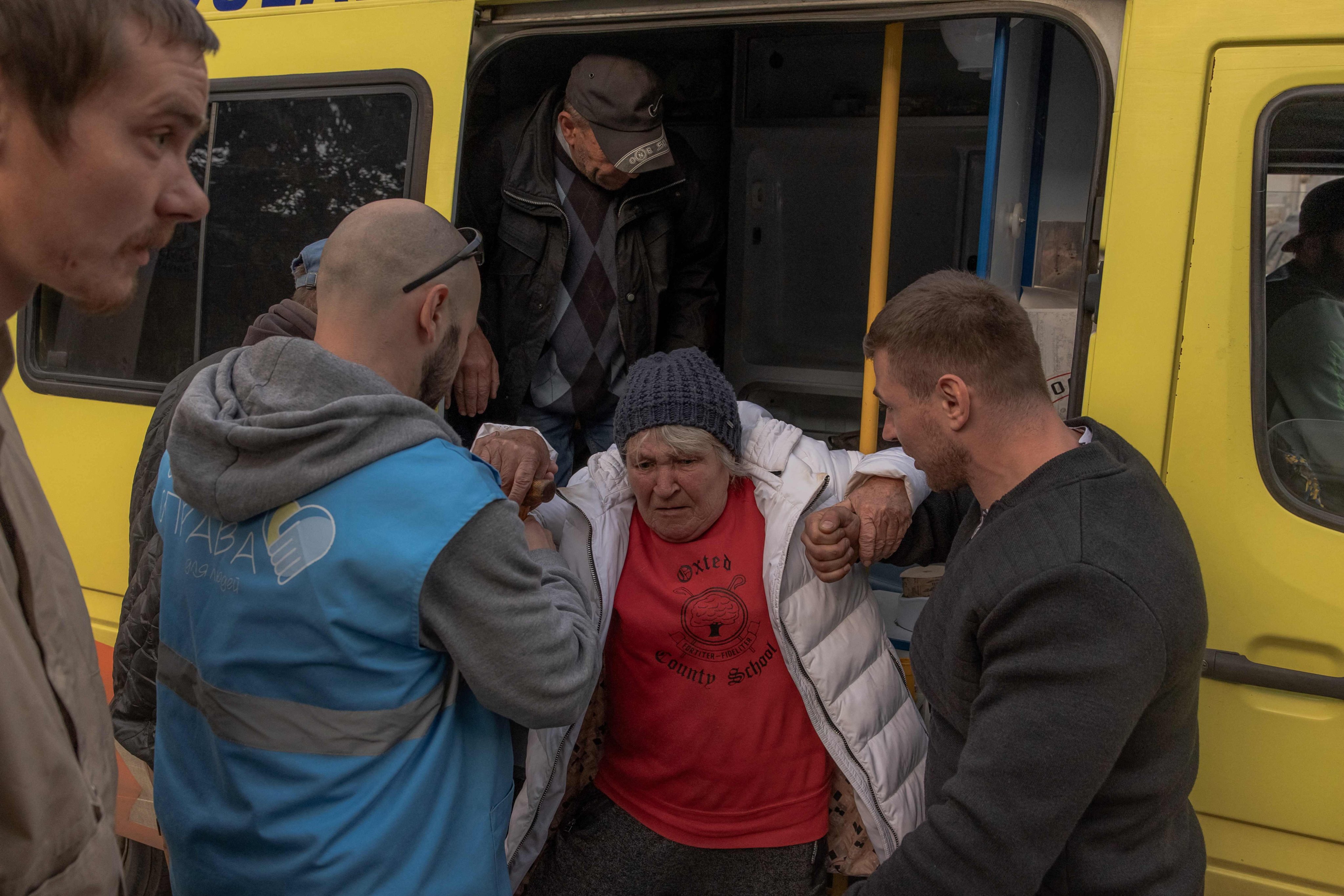Olga Garmash, 68, an evacuee from the village of Lyptsi, arrives at an evacuation point in Kharkiv on Saturday. Photo: AFP