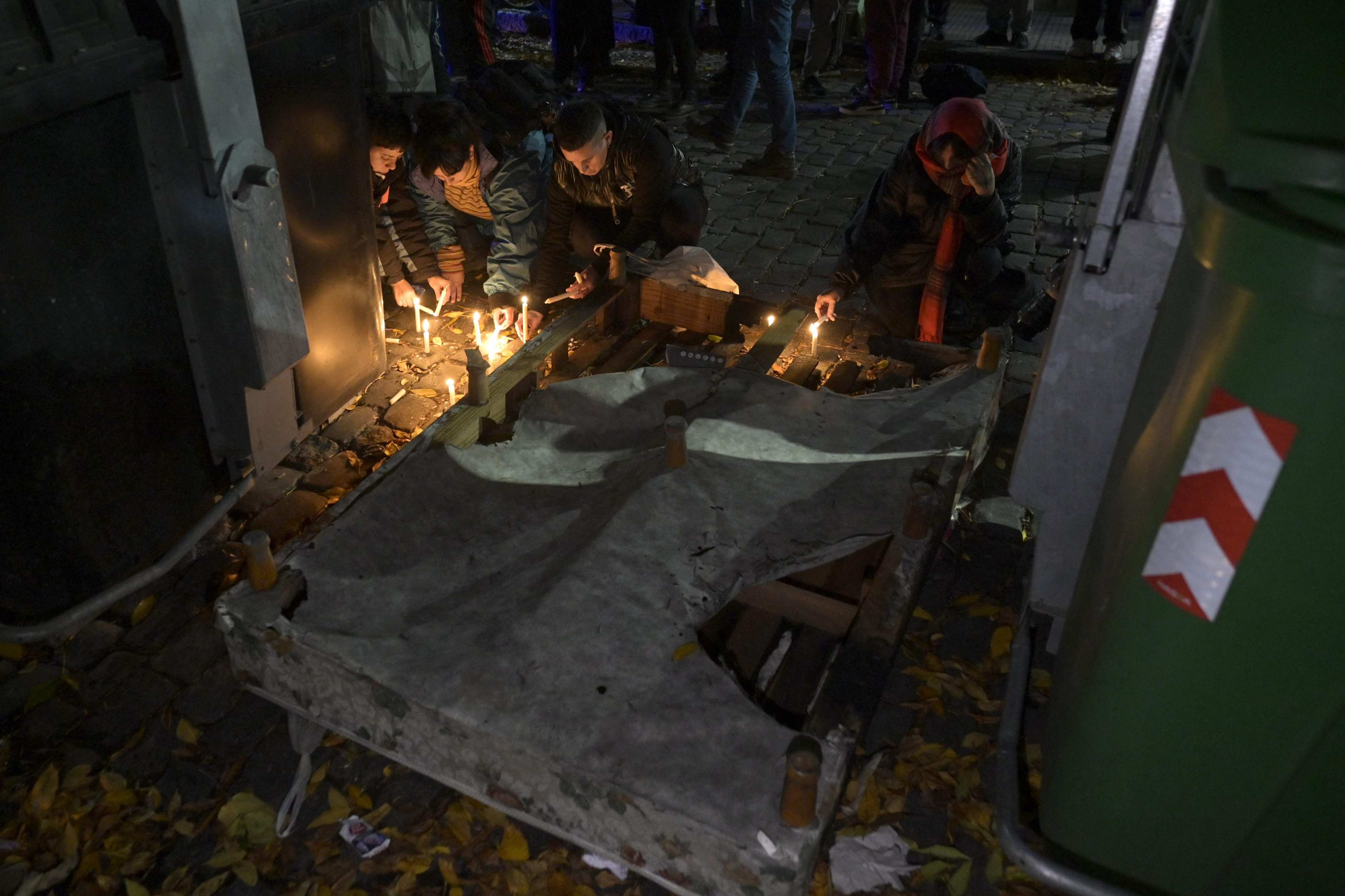 A vigil in front of the house attacked in Buenos Aires, Argentina. Photo: AFP