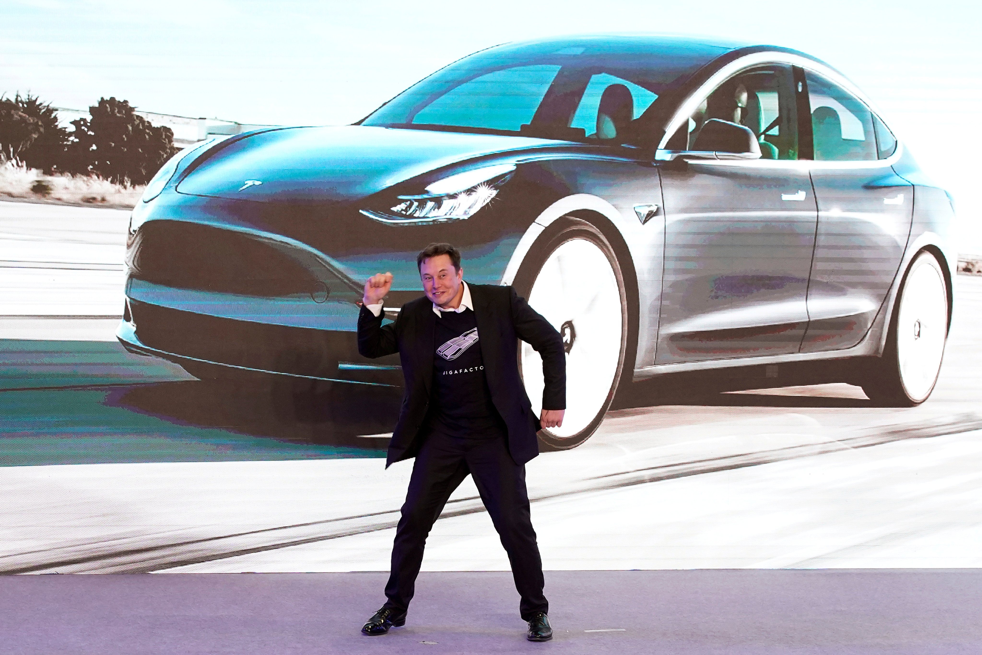 Tesla CEO Elon Musk dances onstage during a delivery event for the company’s China-made Model 3 cars in Shanghai on January 7, 2020. Photo: Reuters