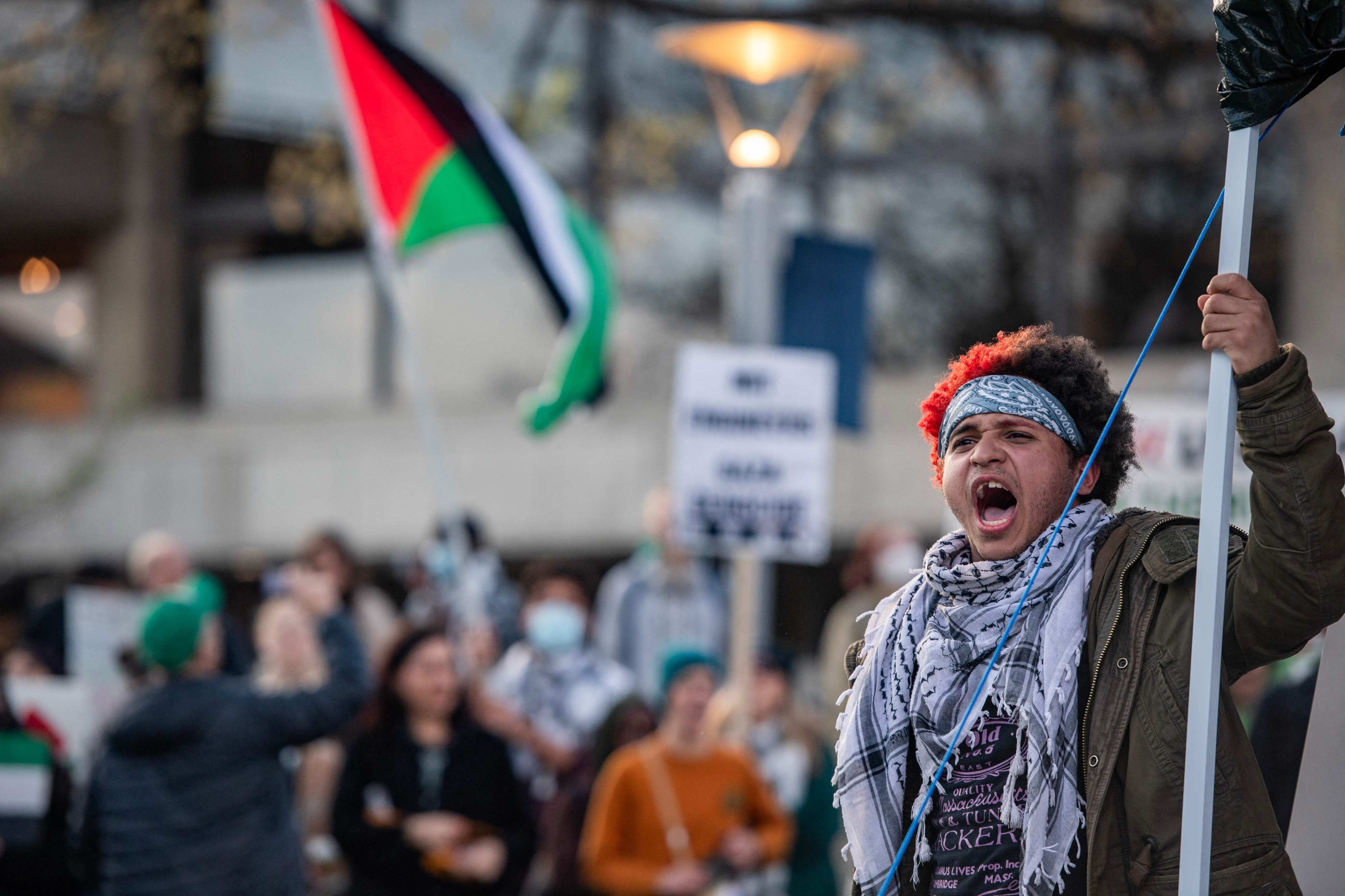 A person cheers as pro-Palestinian students and activists extend their encampment beyond its barriers and to Massachusetts Avenue in front of the Massachusetts Institute of Technology (MIT) in Cambridge, Massachusetts on May 1, 2024. Photo: AFP