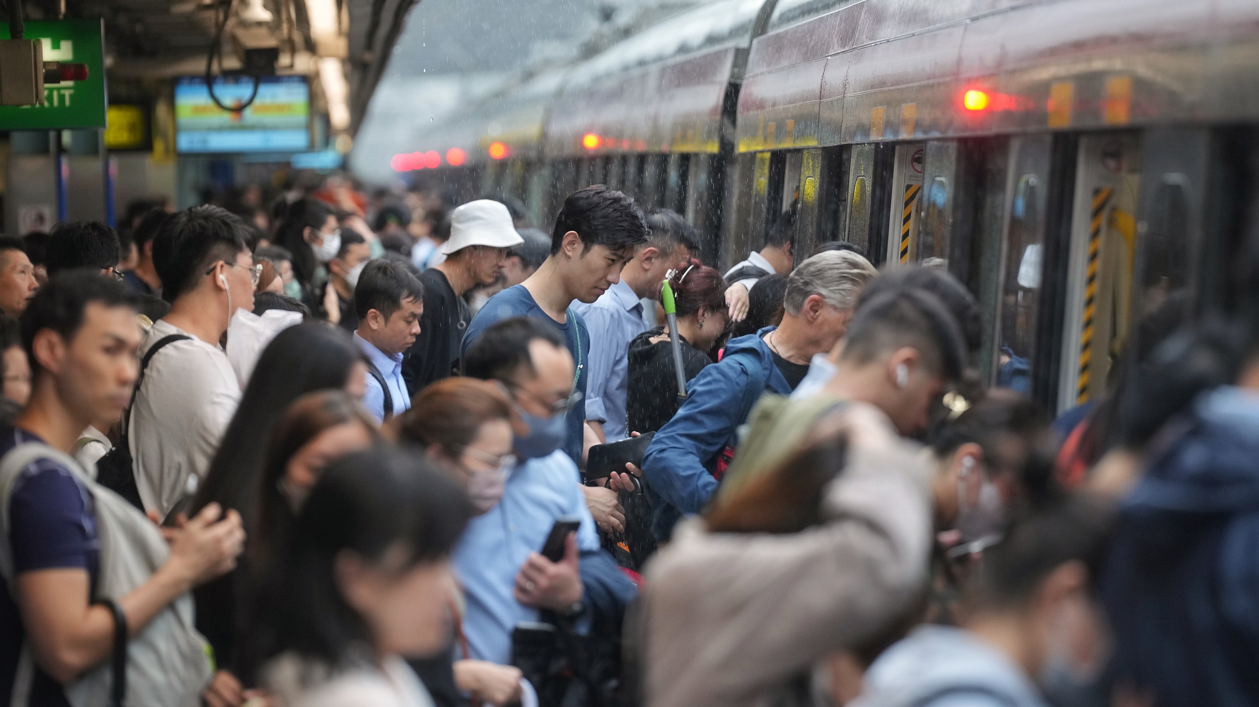People board a train at Hong Kong’s Tai Wai MTR station in the morning of October 9 last year. Urban centres in Europe and elsewhere are considering the feasibility of the 15-minute city, where daily conveniences are located around one’s residence. Photo: Elson LI