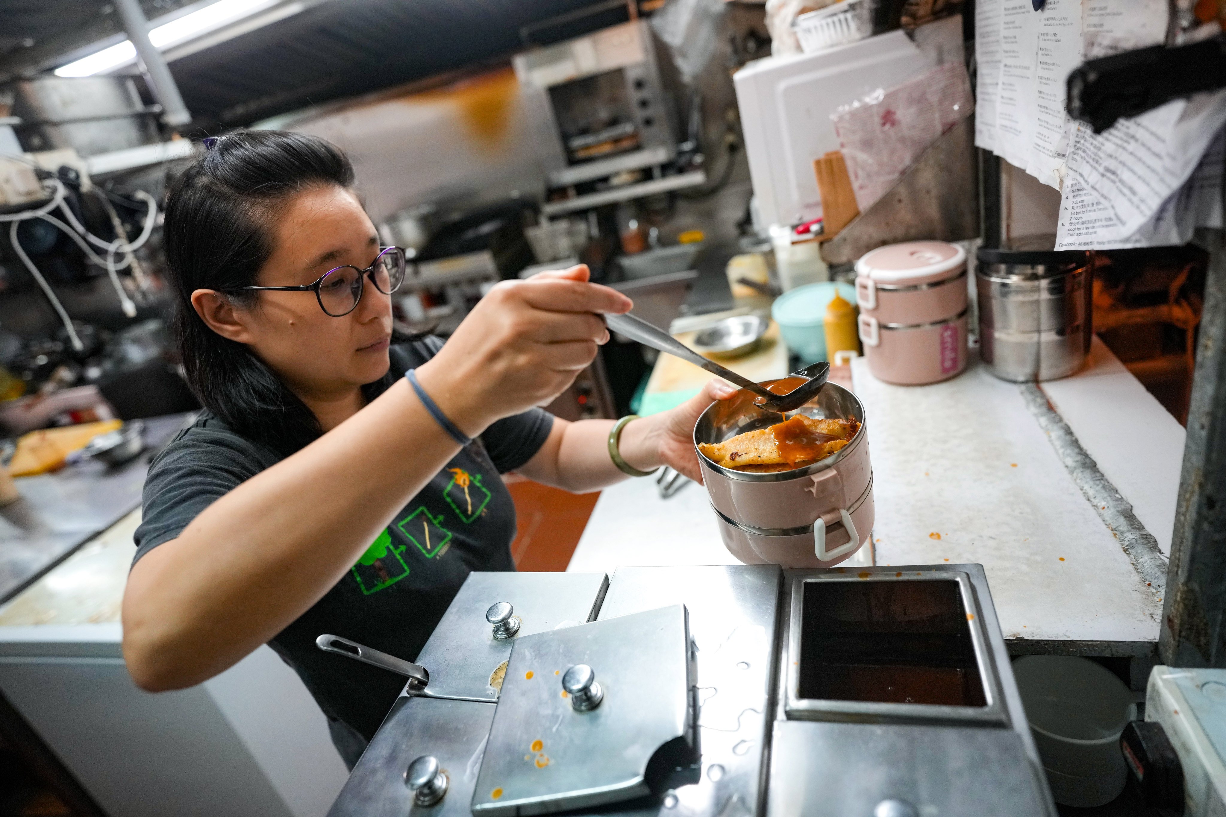 Yvonne Leung, operator of Space Cafe, started switching to reusable lunchboxes for takeaway orders in 2020. Photo: Elson Li
