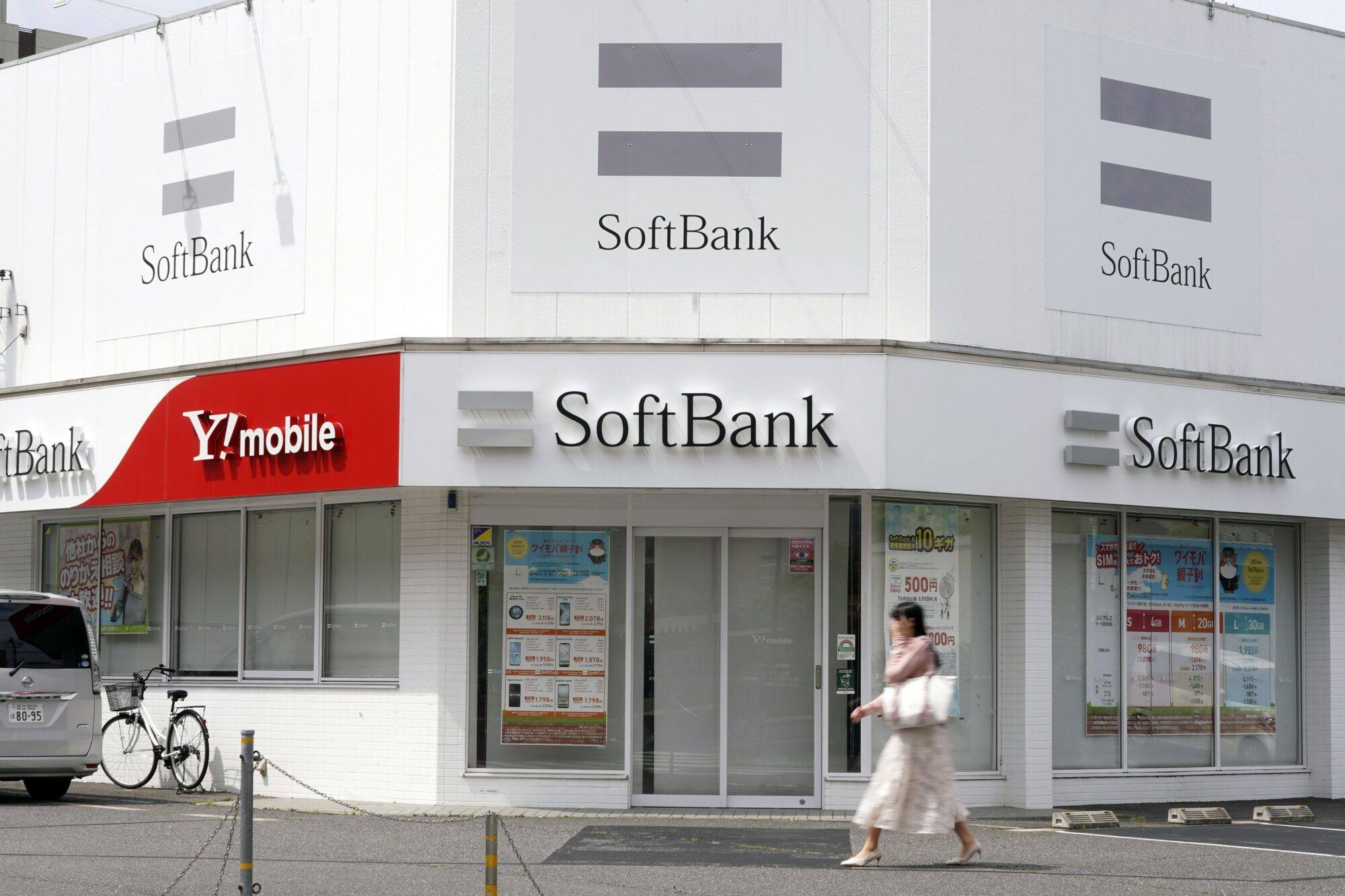 Signage for SoftBank and the company’s Y!mobile brand seen at a store in Tokyo. Photo: Bloomberg
