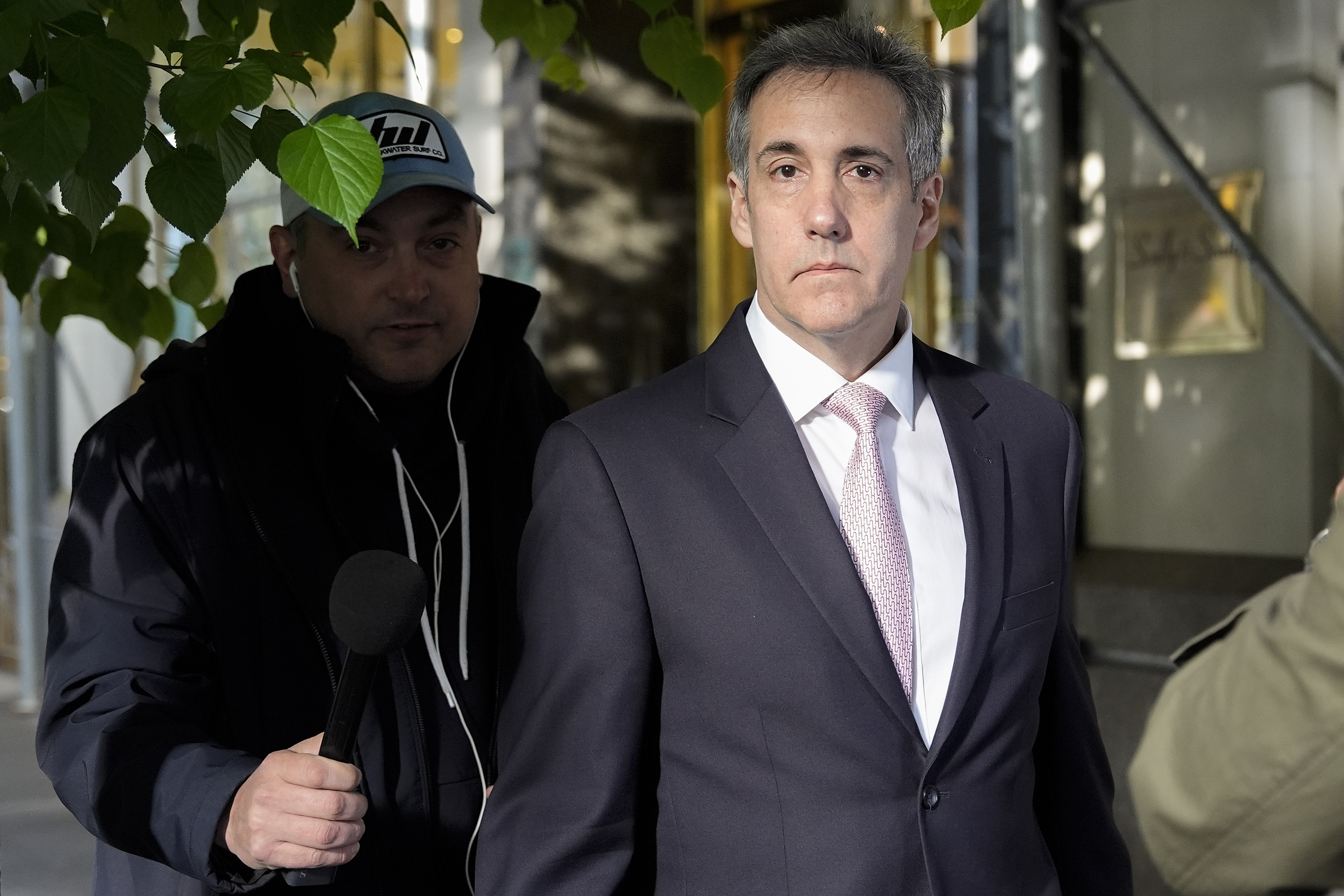 Michael Cohen, right, on his way to Manhattan criminal court in New York on Monday. Photo: AP