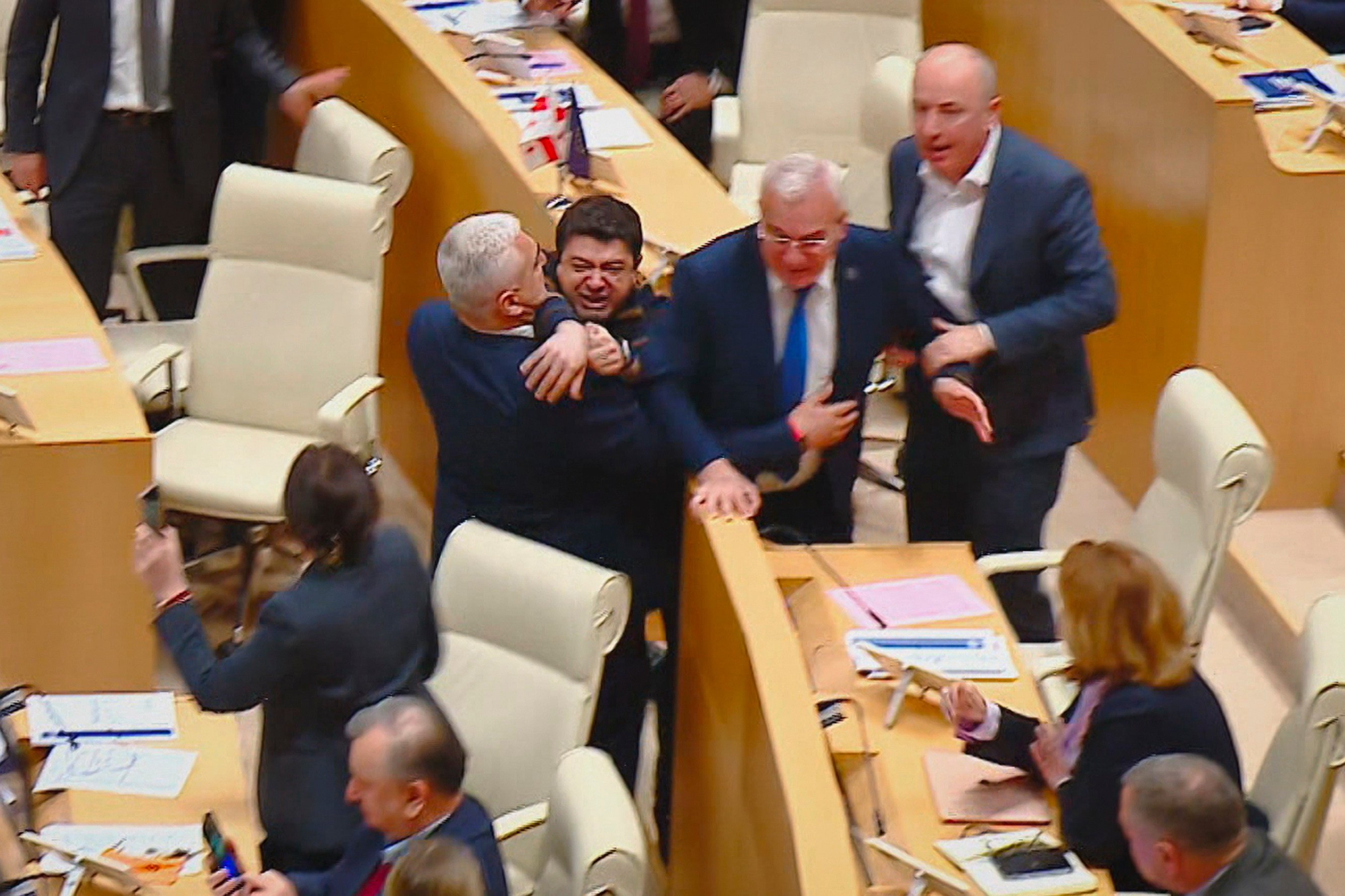 Georgian lawmakers fight during a parliament session in Tbilisi, Georgia. Photo: Mtavari Channel via AP
