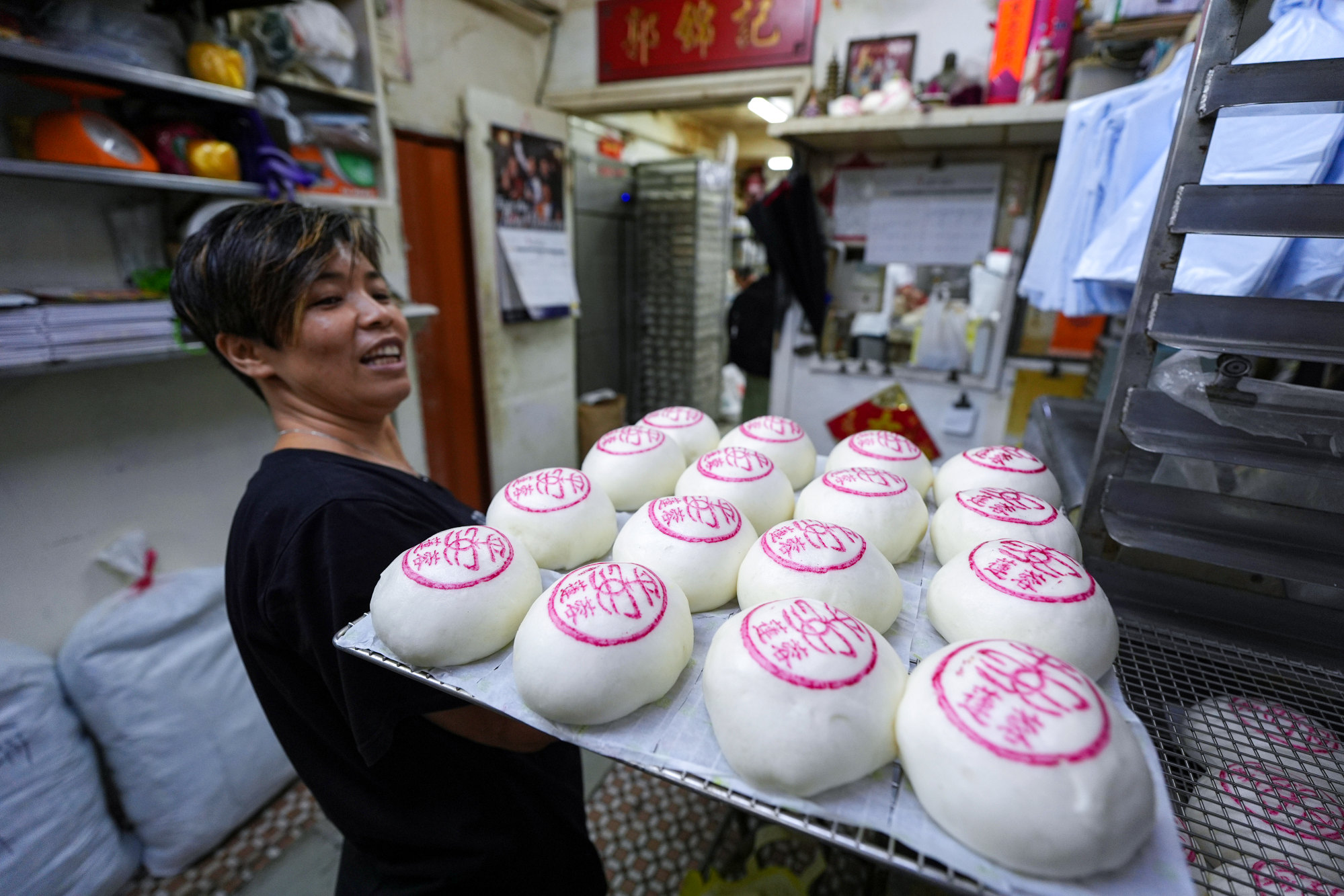 Staff at Kwok Kam Kee Cake Shop on Cheung Chau prepare the festival’s signature peace buns. Photo: Eugene Lee
