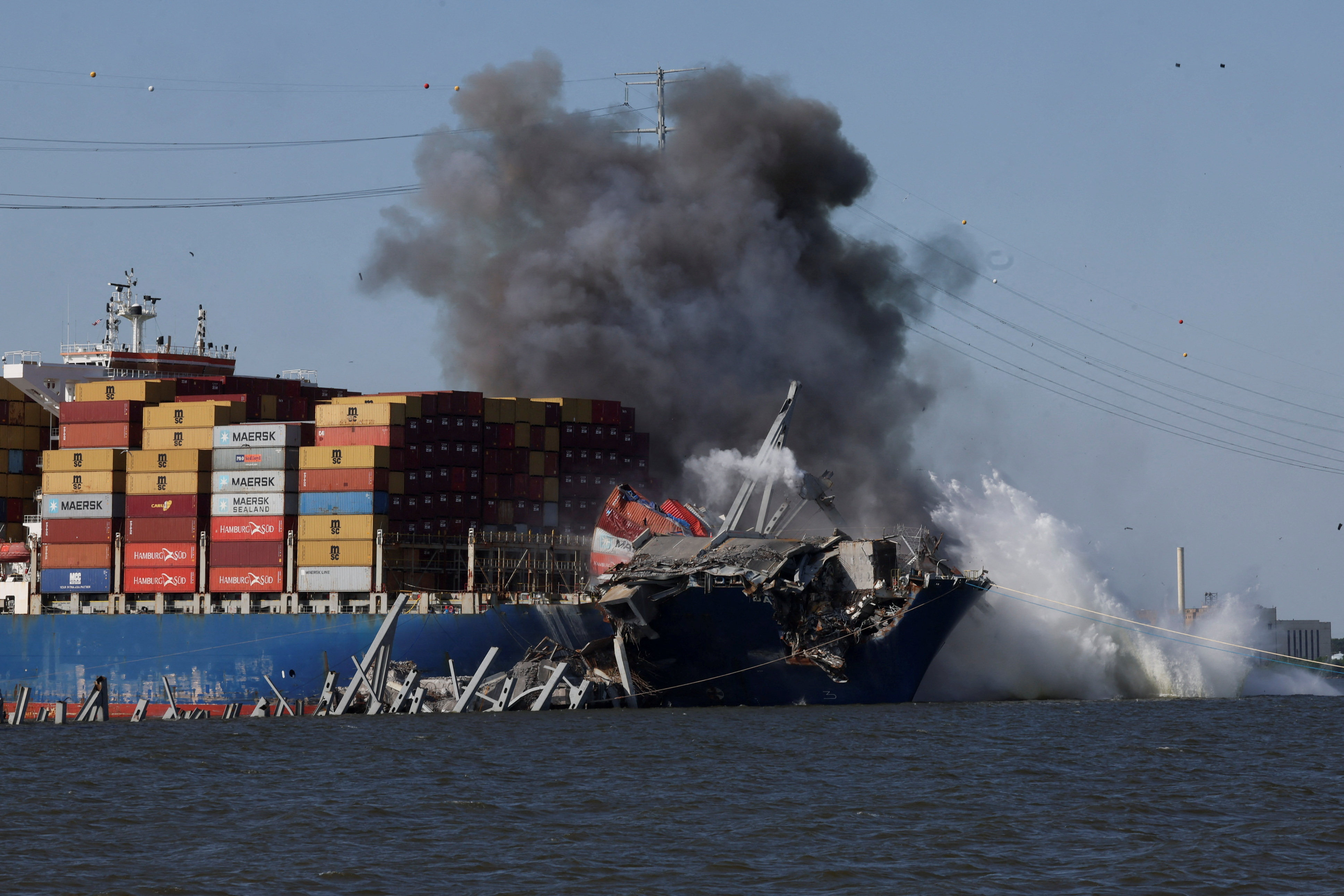 Smoke rises after a detonation of explosives to free the container ship Dali at the Francis Scott Key Bridge in Baltimore, Maryland on Monday. Photo: Reuters 