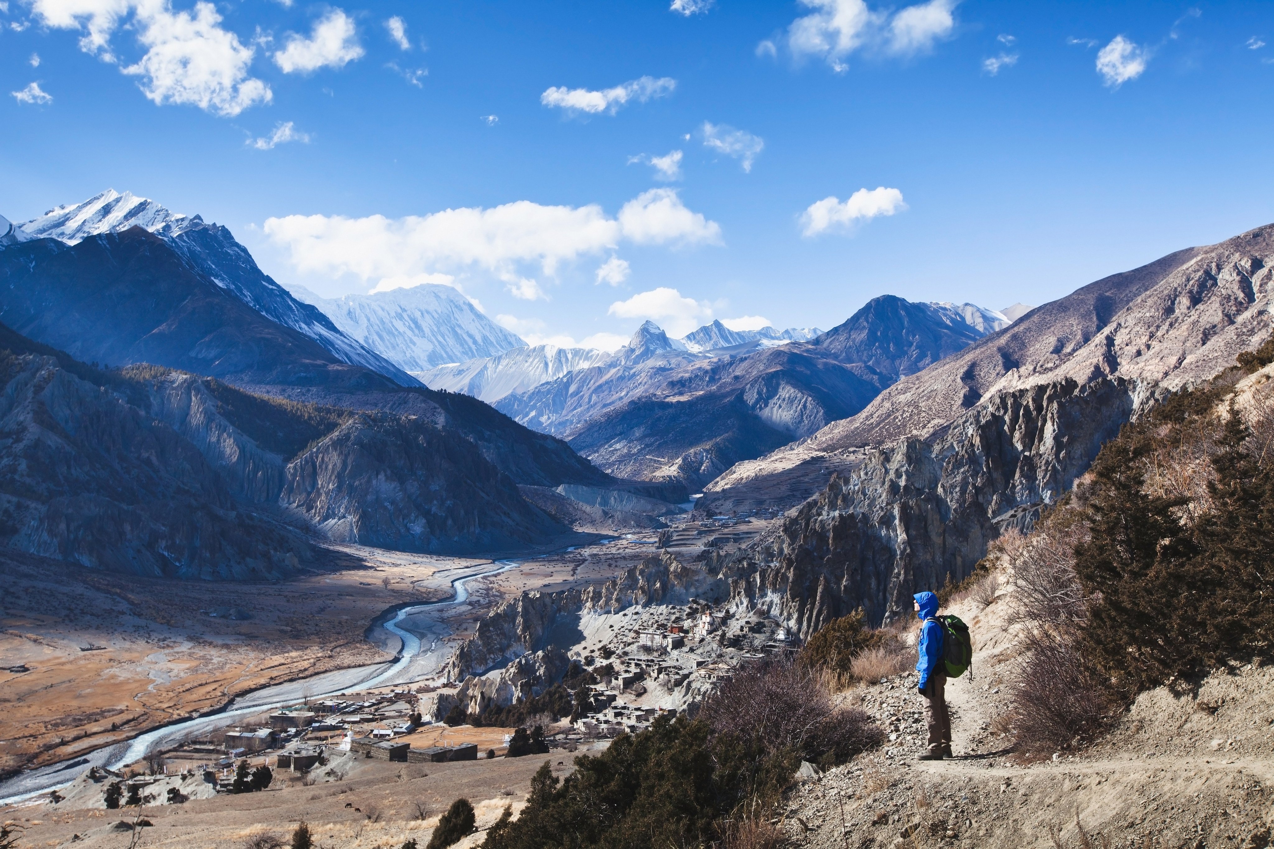 A hiker looks out at mountains on the Annapurna Circuit in Nepal. Photo: Shutterstock