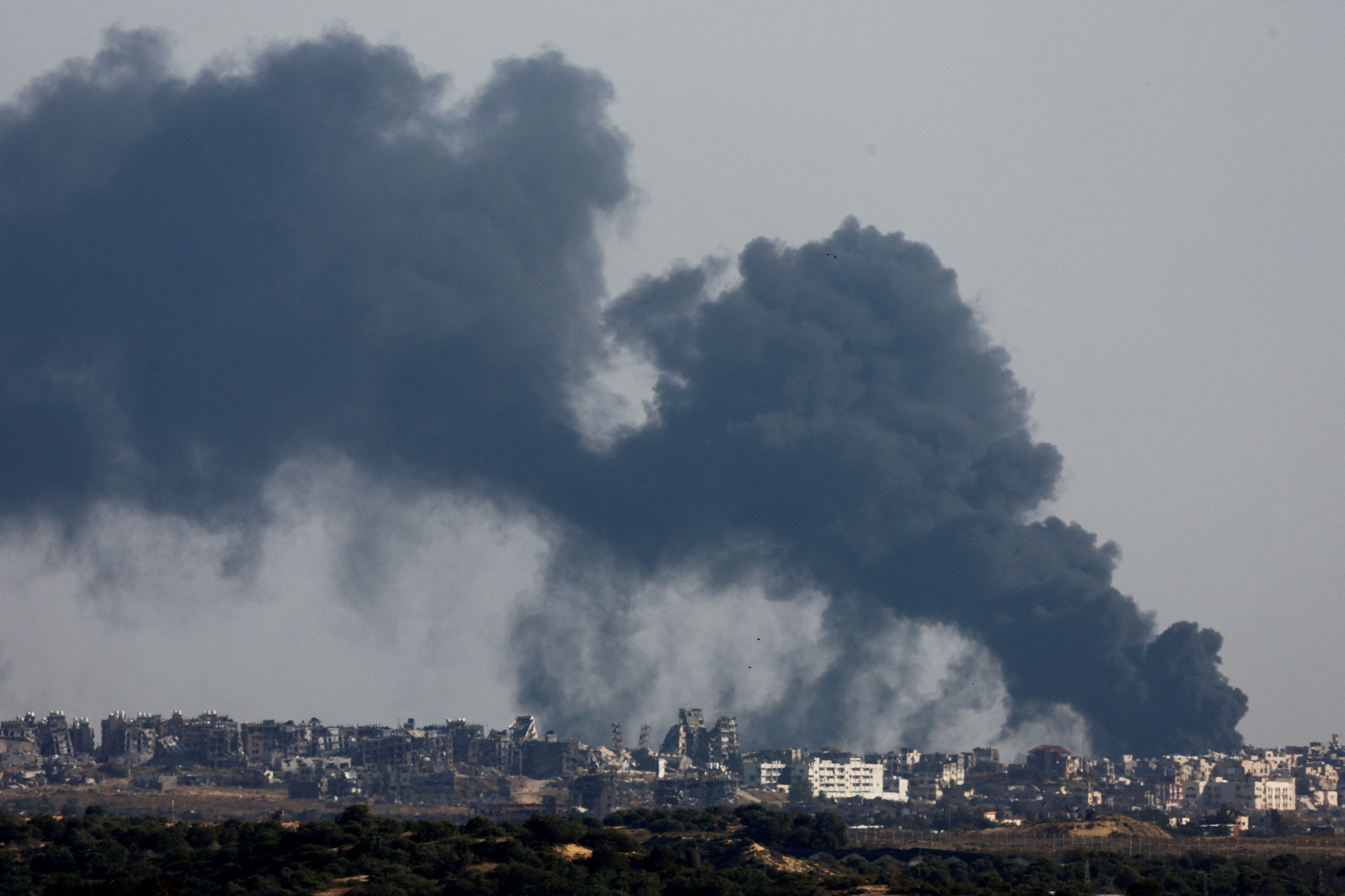 Smoke billows after an explosion in northern Gaza as seen from Israel on Sunday. Photo: Reuters
