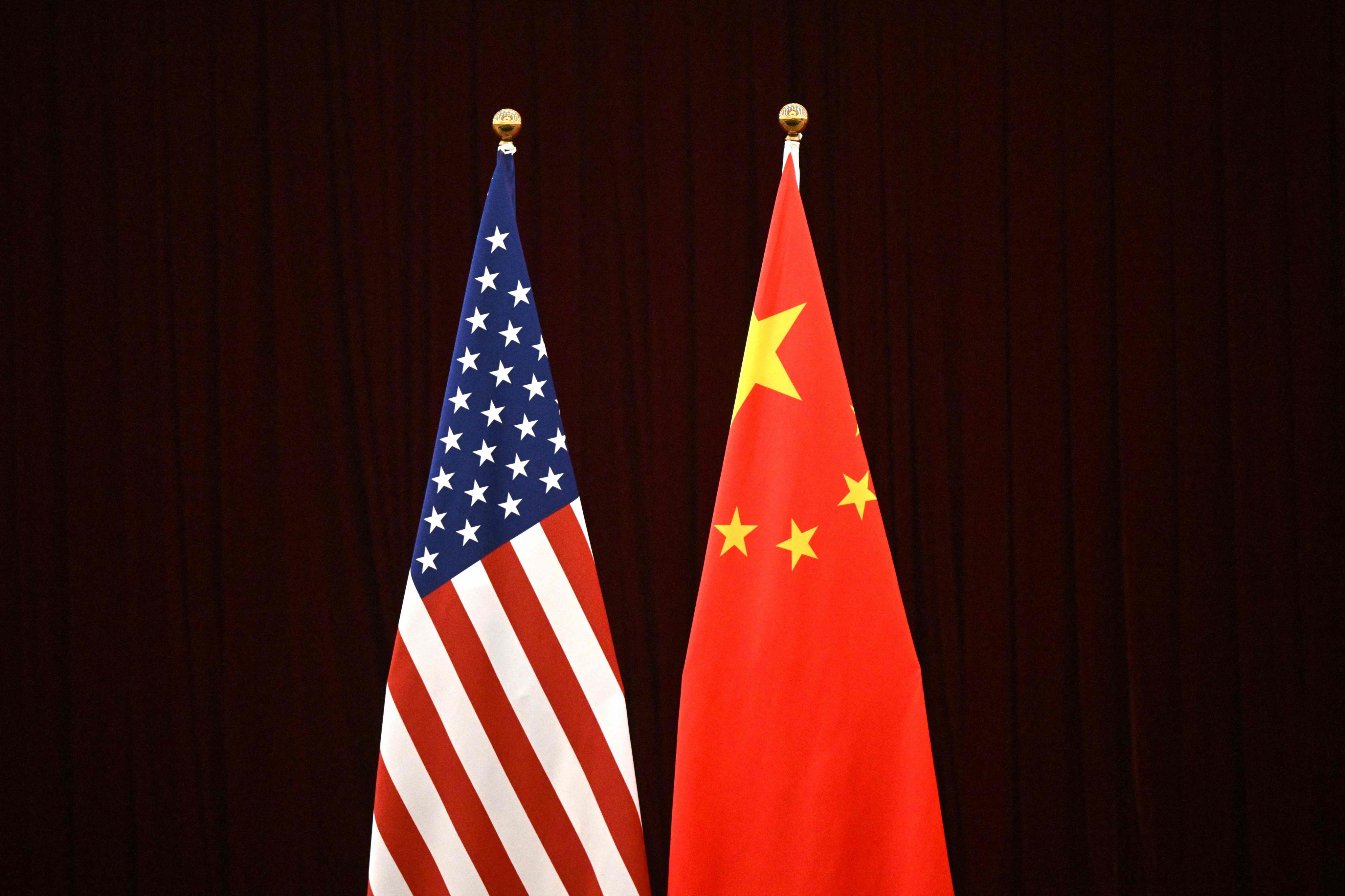 The flags of China and the US. The White House said it is forcing a Chinese-linked company to sell property near a US air base in Wyoming. Photo: AFP