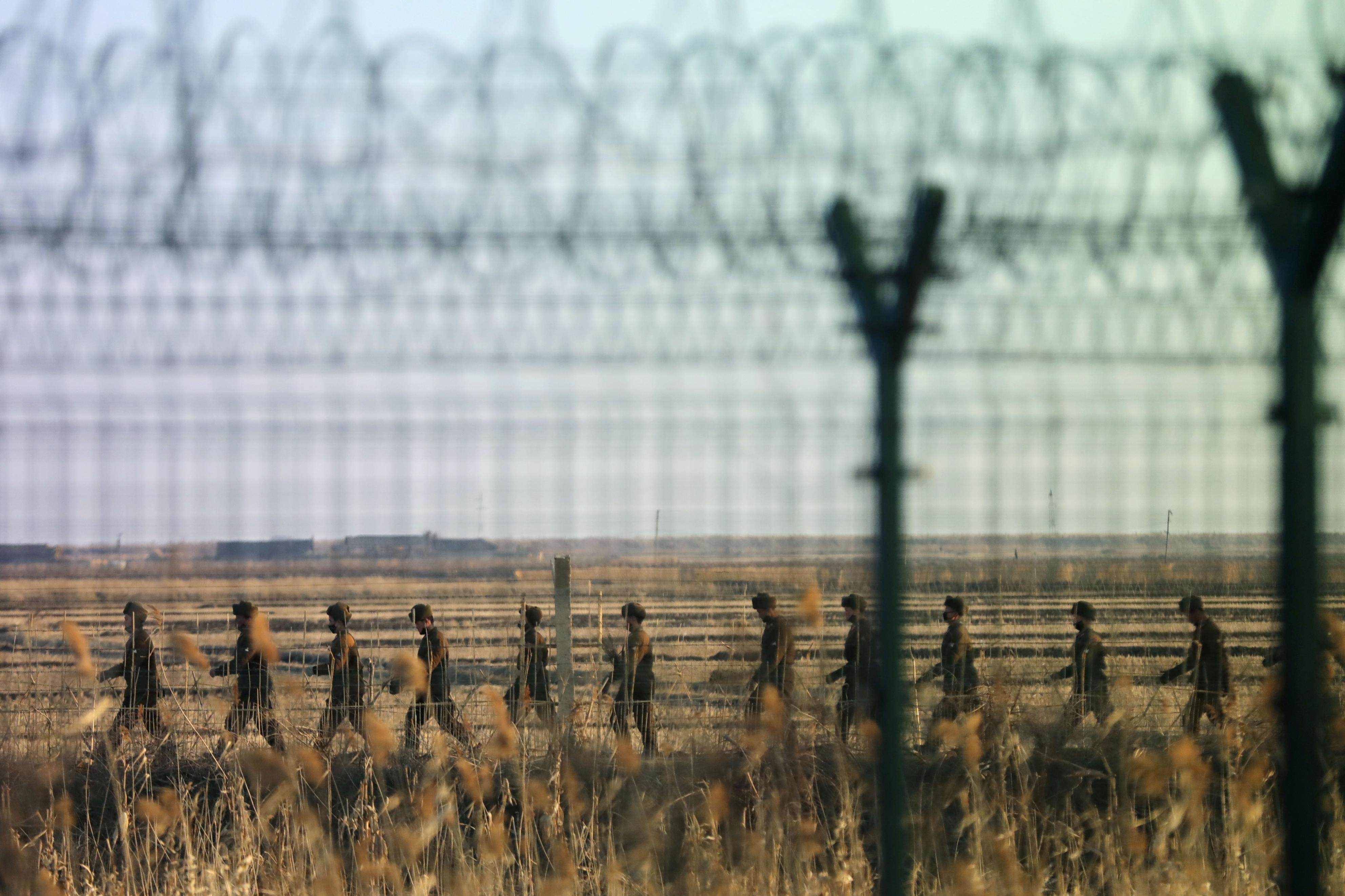 North Korean soldiers patrolling a border area with China. The isolated nation has boosted efforts to use cameras and facial recognition to track its population. Photo: Kyodo