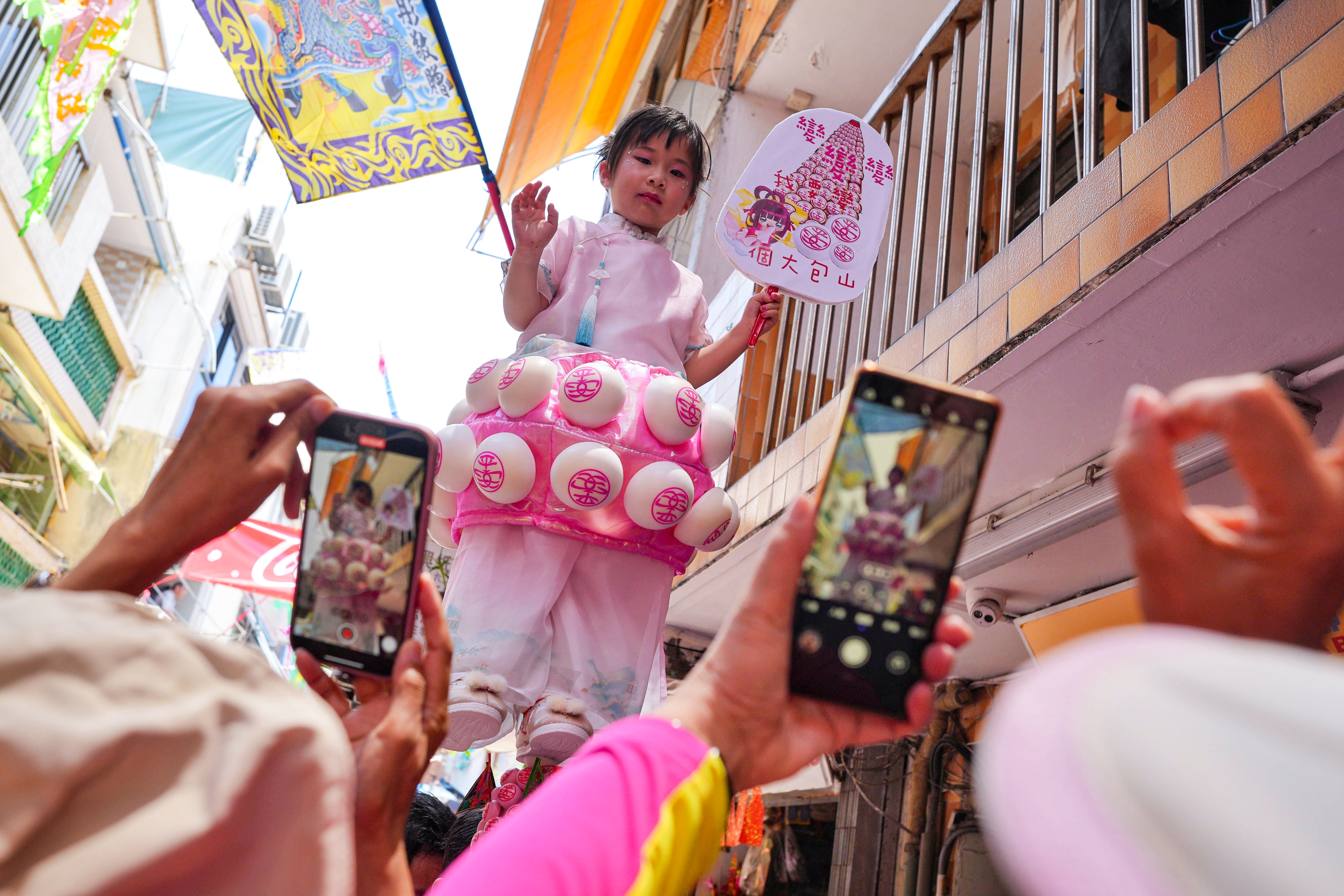 The parade featuring young children in costumes is a highlight of the festival. Photo: Elson Li