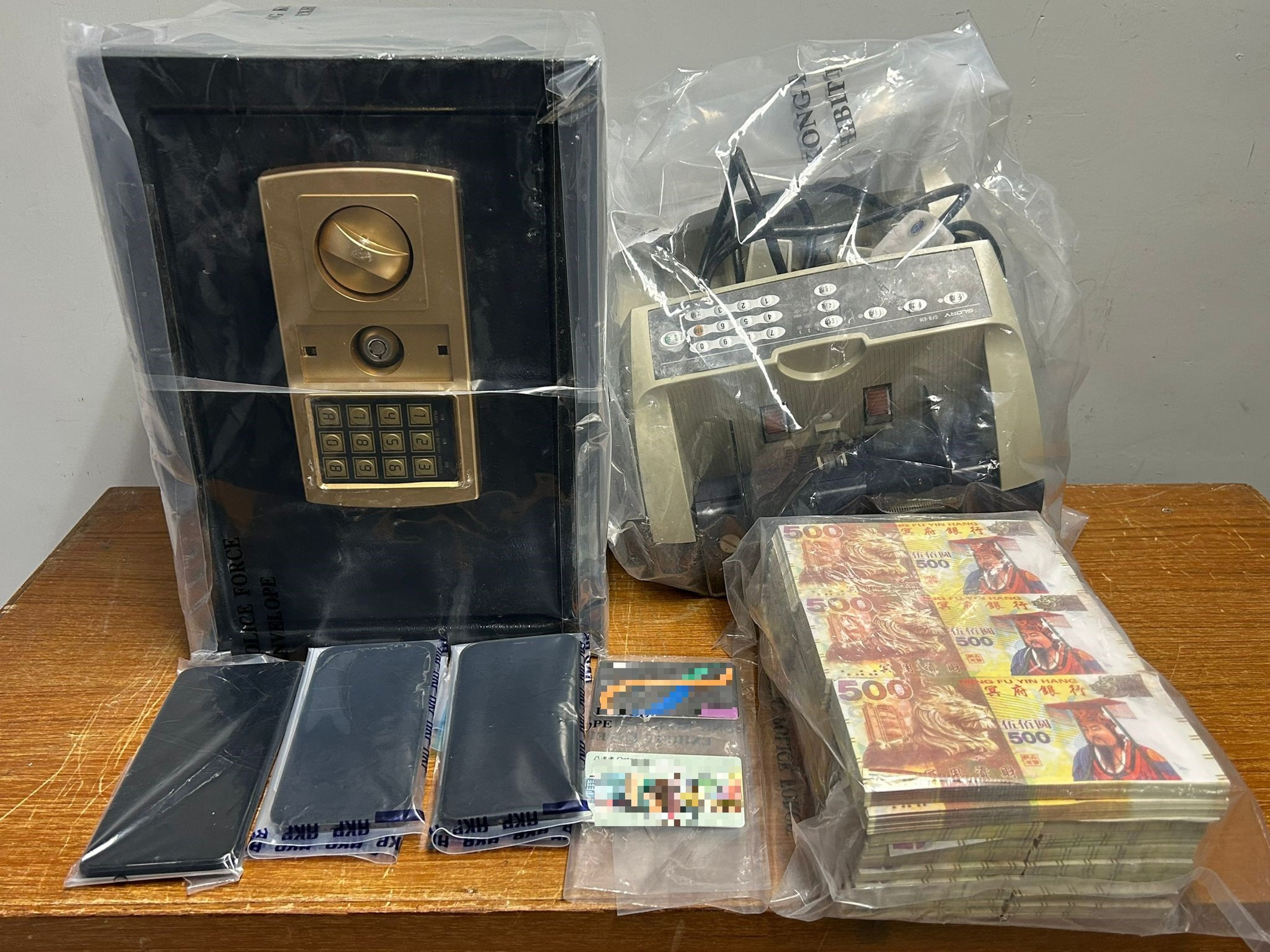 Police seized “hell money”, a safe and a  banknote counting machine from the shop. Photo: Handout