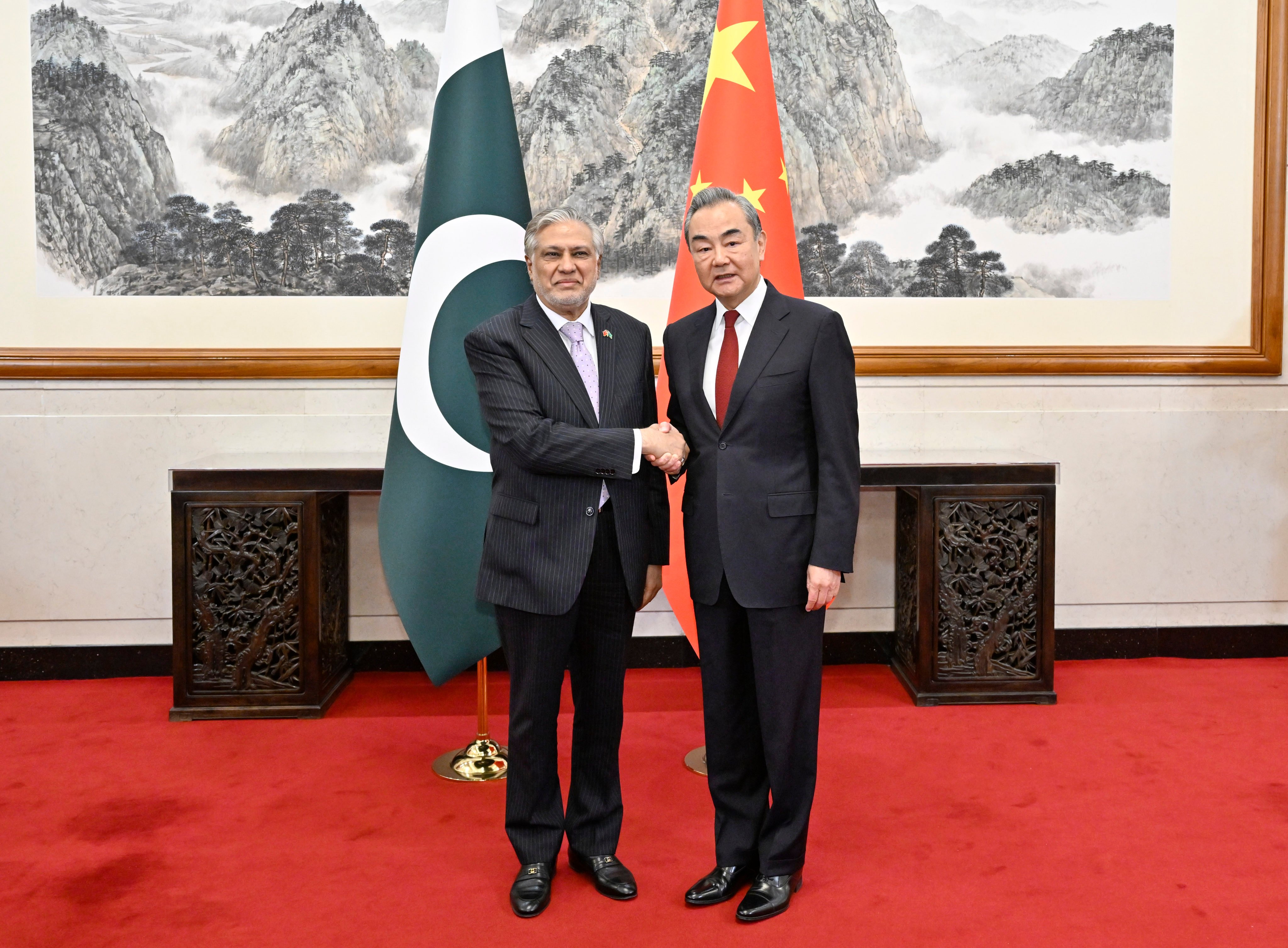 Ishaq Dar, Pakistan’s deputy prime minister (left), meets Wang Yi, China’s top diplomat, in Beijing on Wednesday. Photo: Xinhua