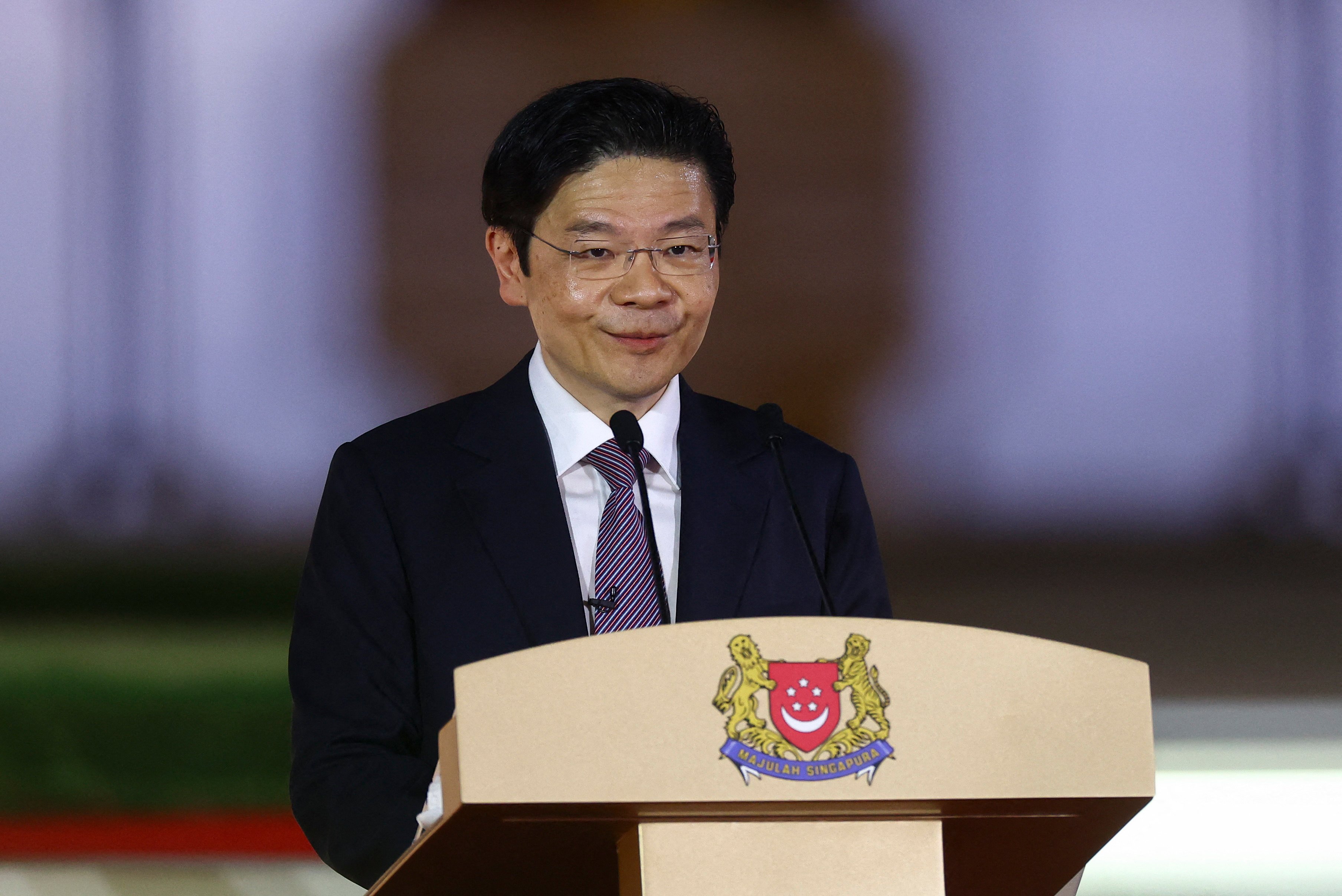 Singapore’s new leader Lawrence Wong makes a speech after being sworn in at the Istana. Photo: AFP