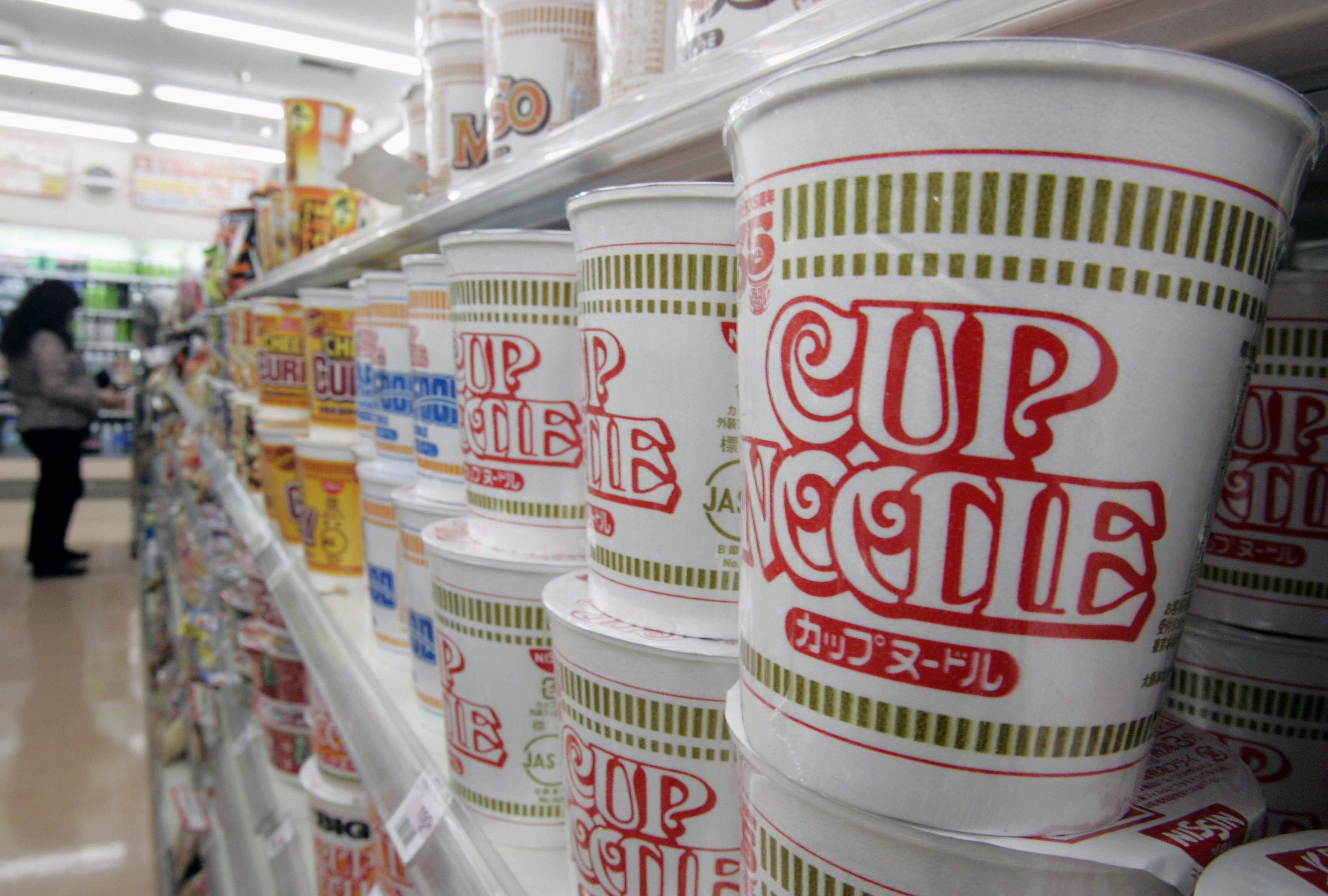 Nissin cup noodles stacked at a convenience store in Tokyo. Photo: Reuters
