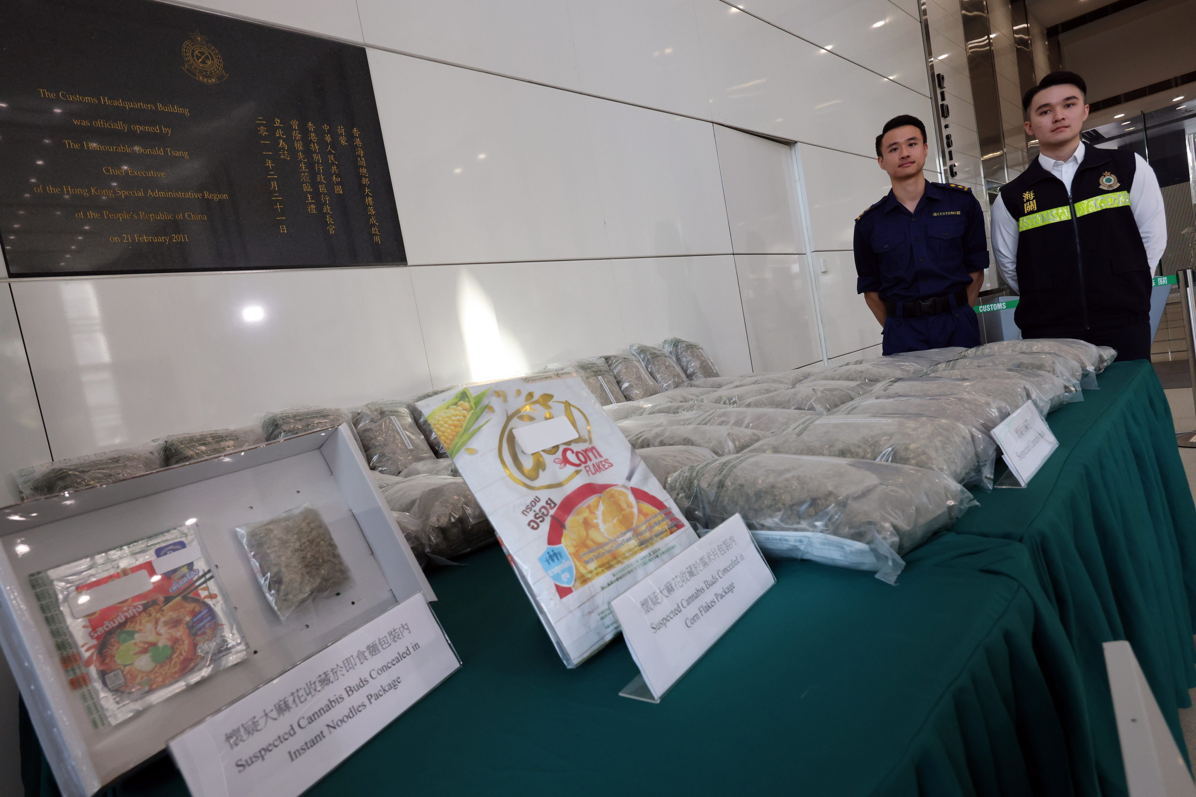 (From left) Customs officers Lai Tsz-hong and Jacky Yau display a HK$16 million haul of cannabis buds. Photo: Jelly Tse
