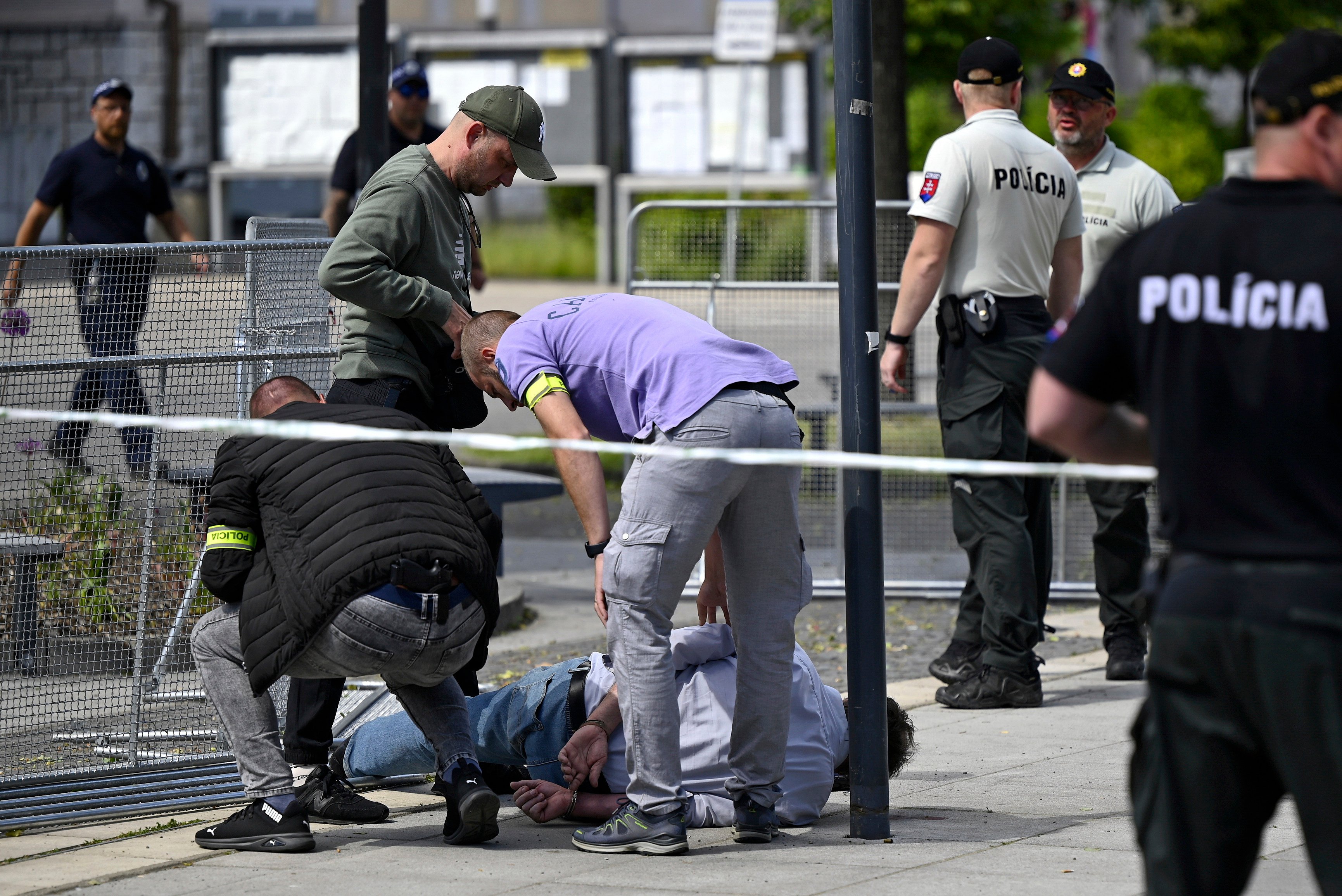 Police arrest a man after Slovak Prime Minister Robert Fico was shot on Wednesday. Photo: Radovan Stoklasa/TASR via AP