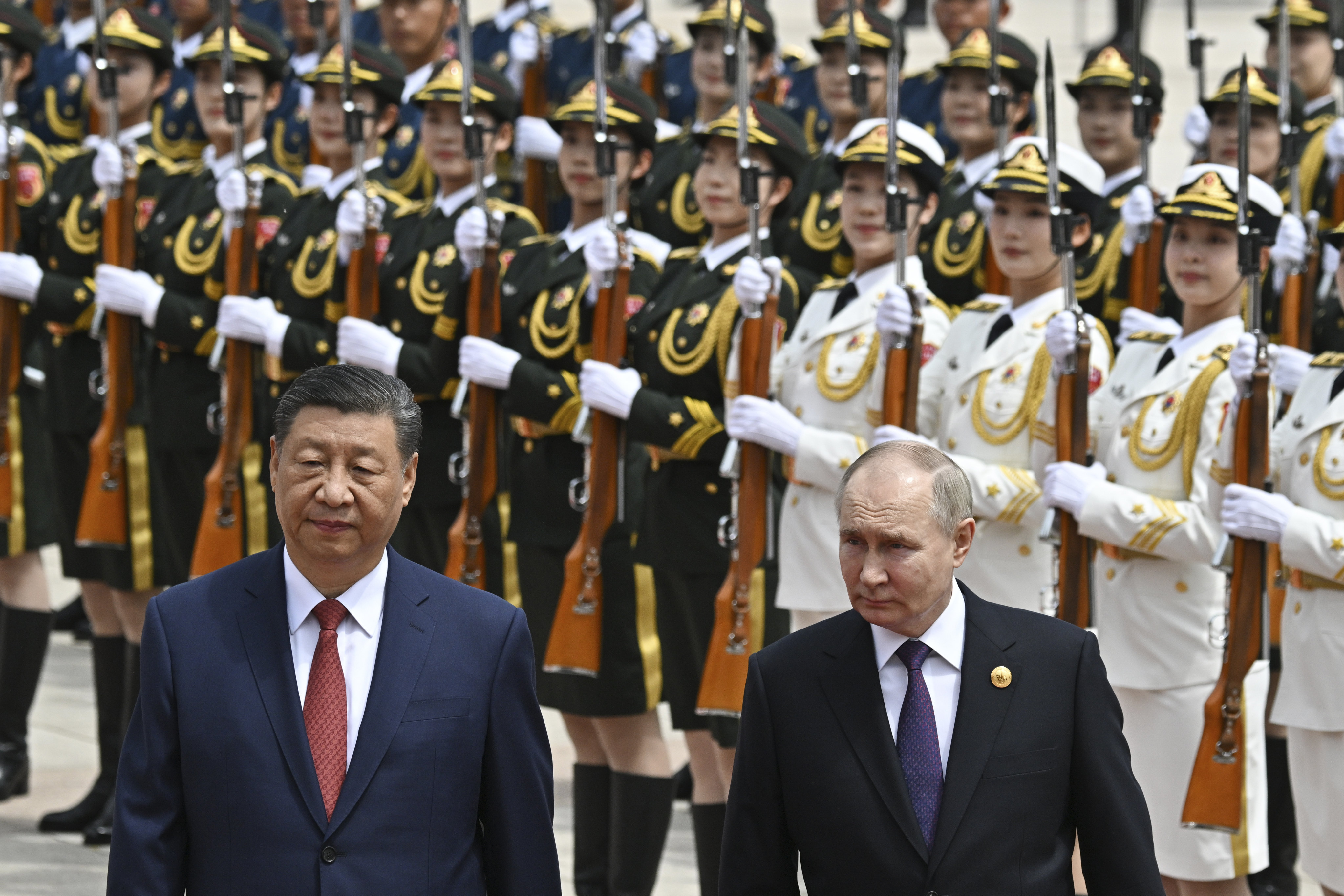 Chinese President Xi Jinping and Russian leader Vladimir Putin review an honour guard at a welcome ceremony in Beijing on Thursday. Photo: Pool via AP