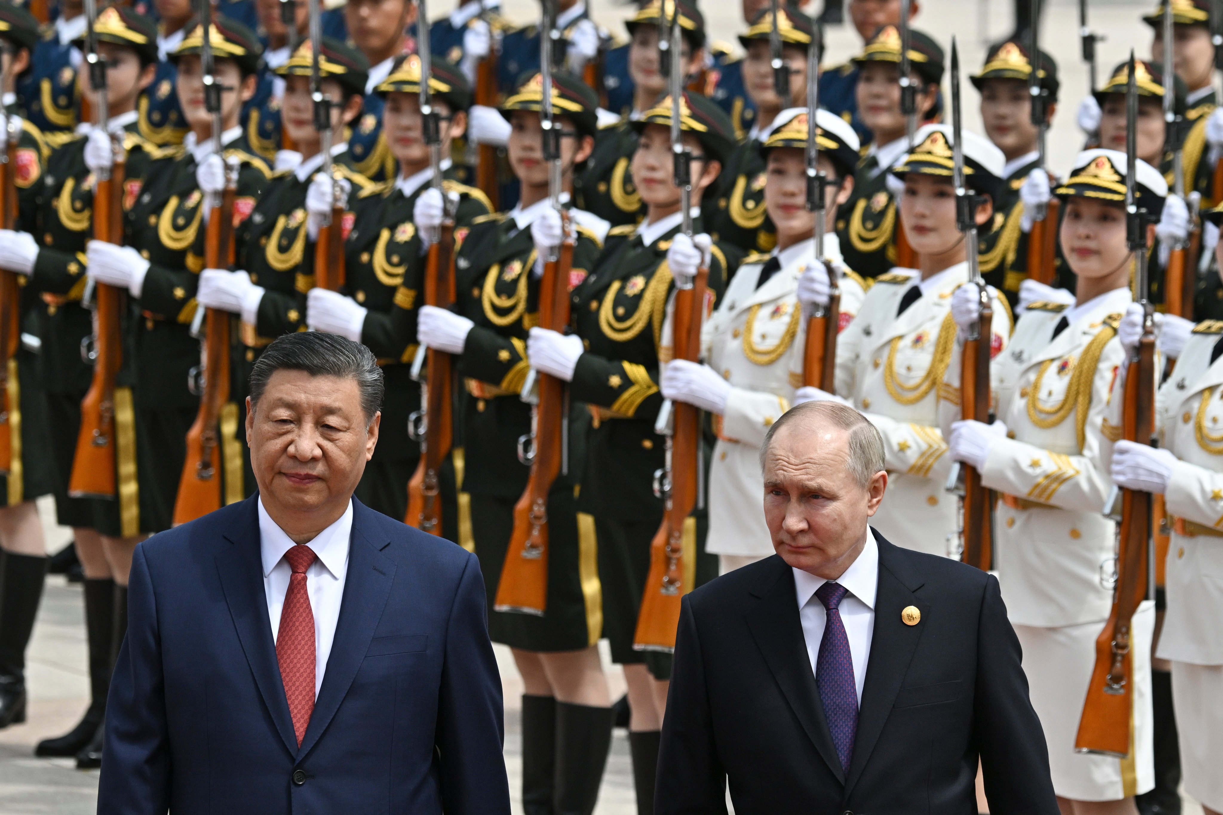 Chinese President Xi Jinping and Russian leader Vladimir Putin review an honour guard at a welcome ceremony in Beijing on Thursday. Photo: Pool via AP