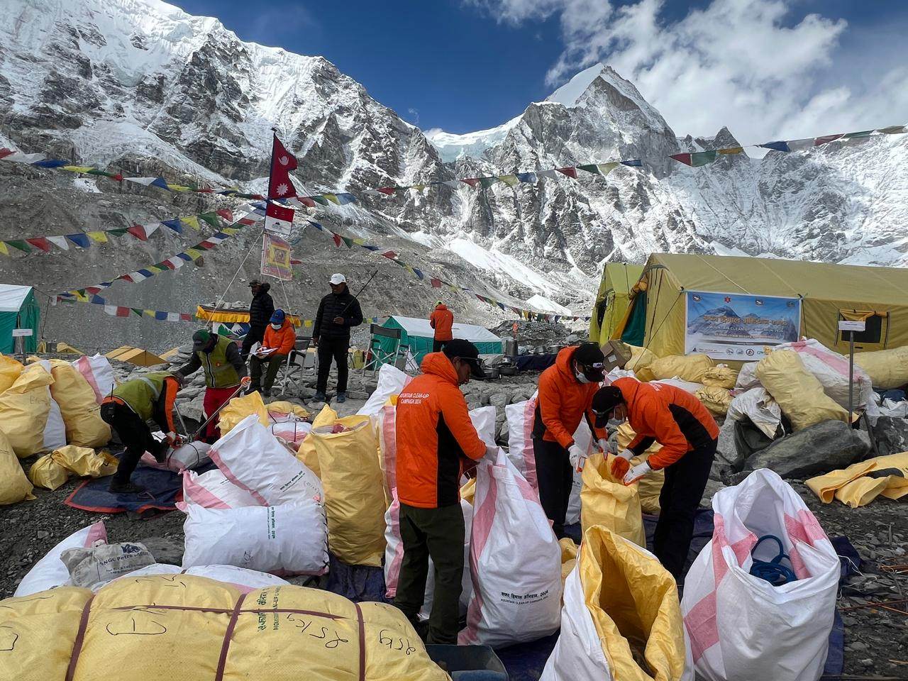Team members of the Clean Mountain Campaign sort through trash at Everest Base Camp. Photo: Clean Mountain Campaign/Handout