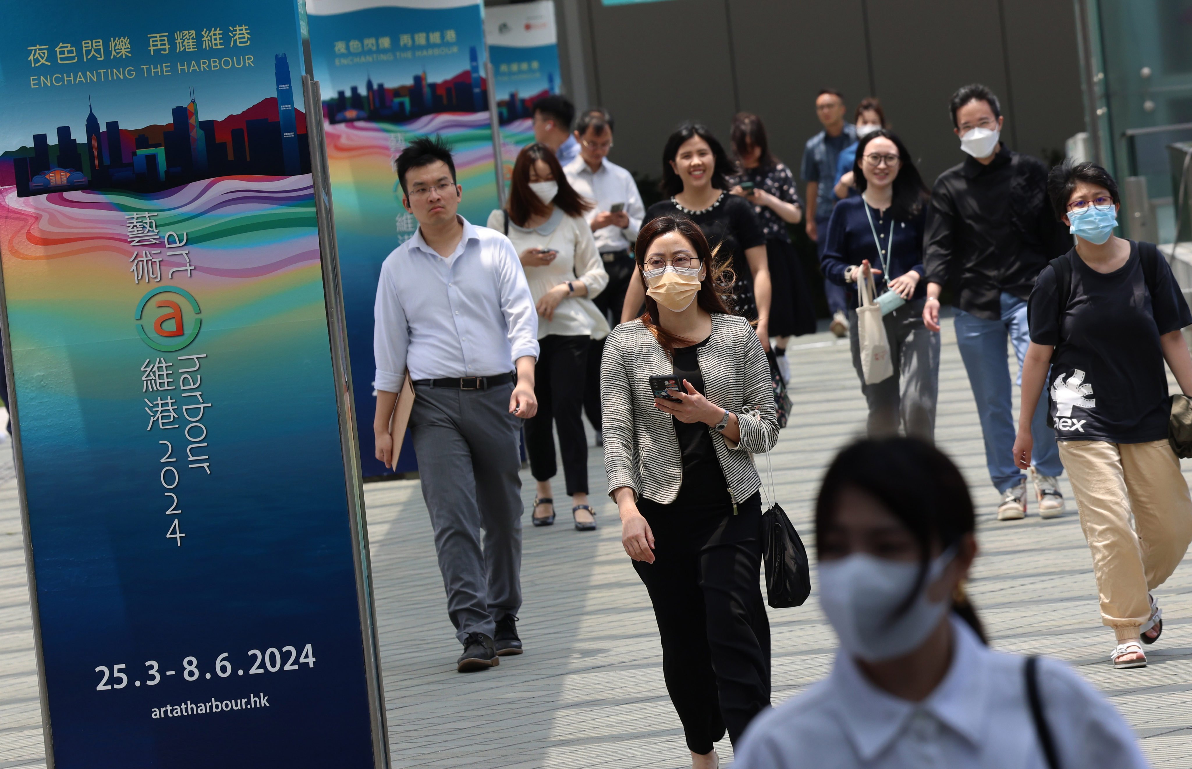 Civil servants leave the Central Government Offices in Admiralty during lunch time. Photo: Jelly Tse