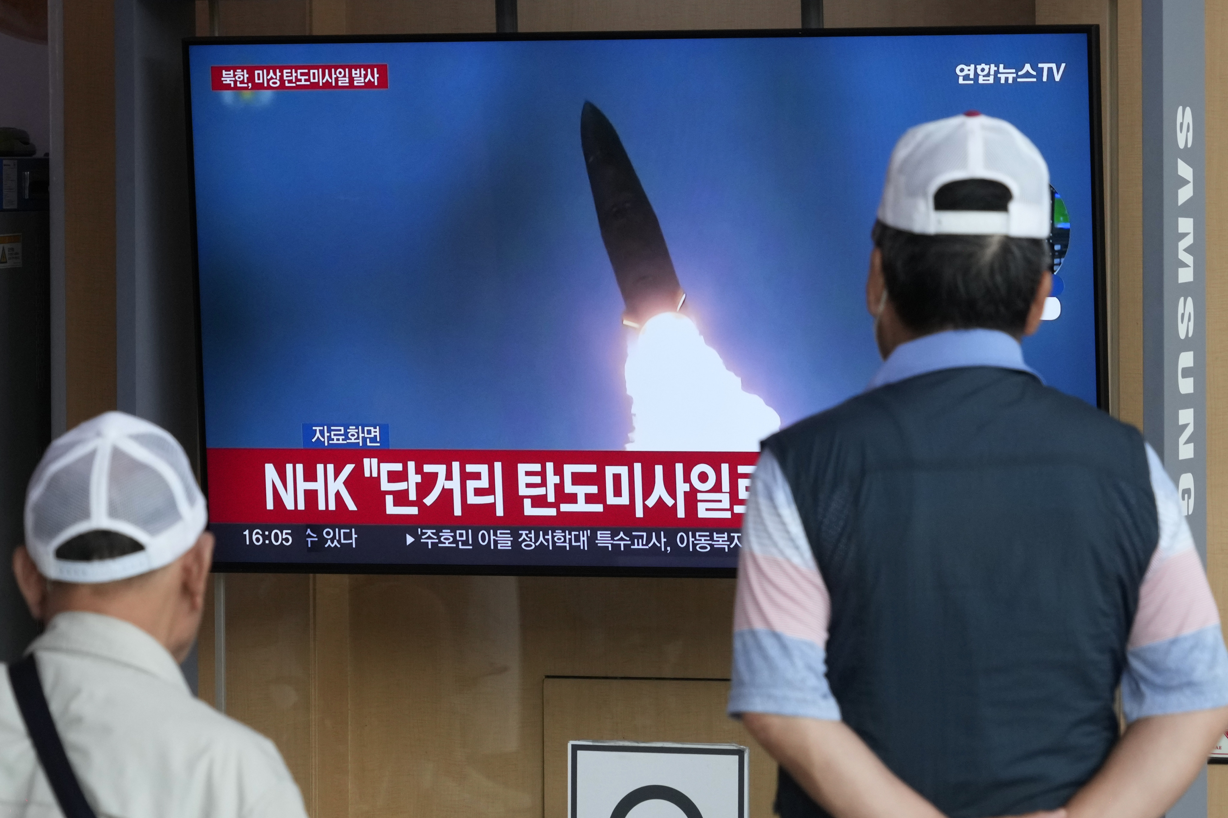 A TV screen shows a file image of North Korea’s missile launch during a news program at the Seoul Railway Station in Seoul, South Korea on Friday. Photo: AP