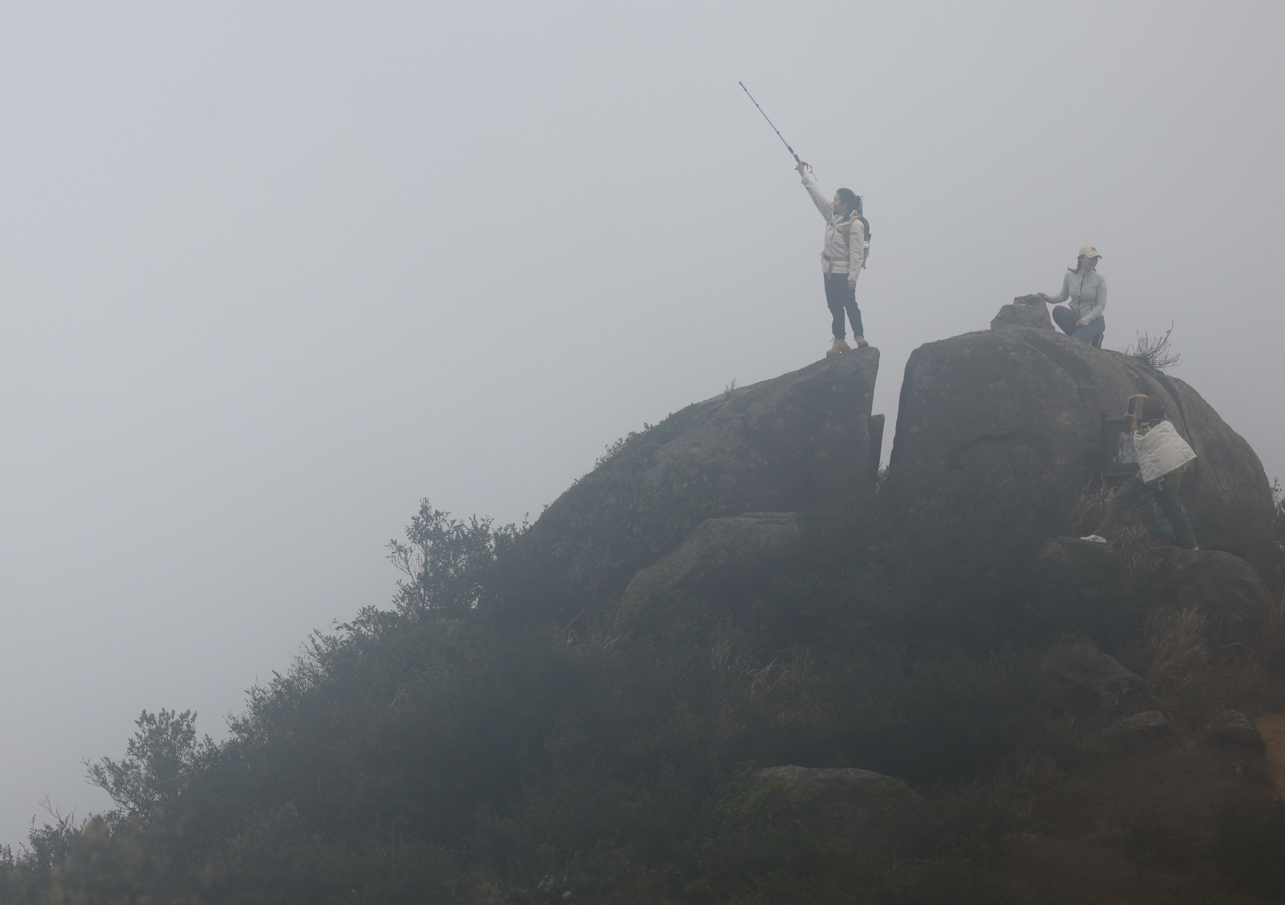 A visitor is seen on Tai Mo Shan, the highest mountain in Hong Kong, 957 meters (3,100 feet) above sea level. Photo: Dickson Lee