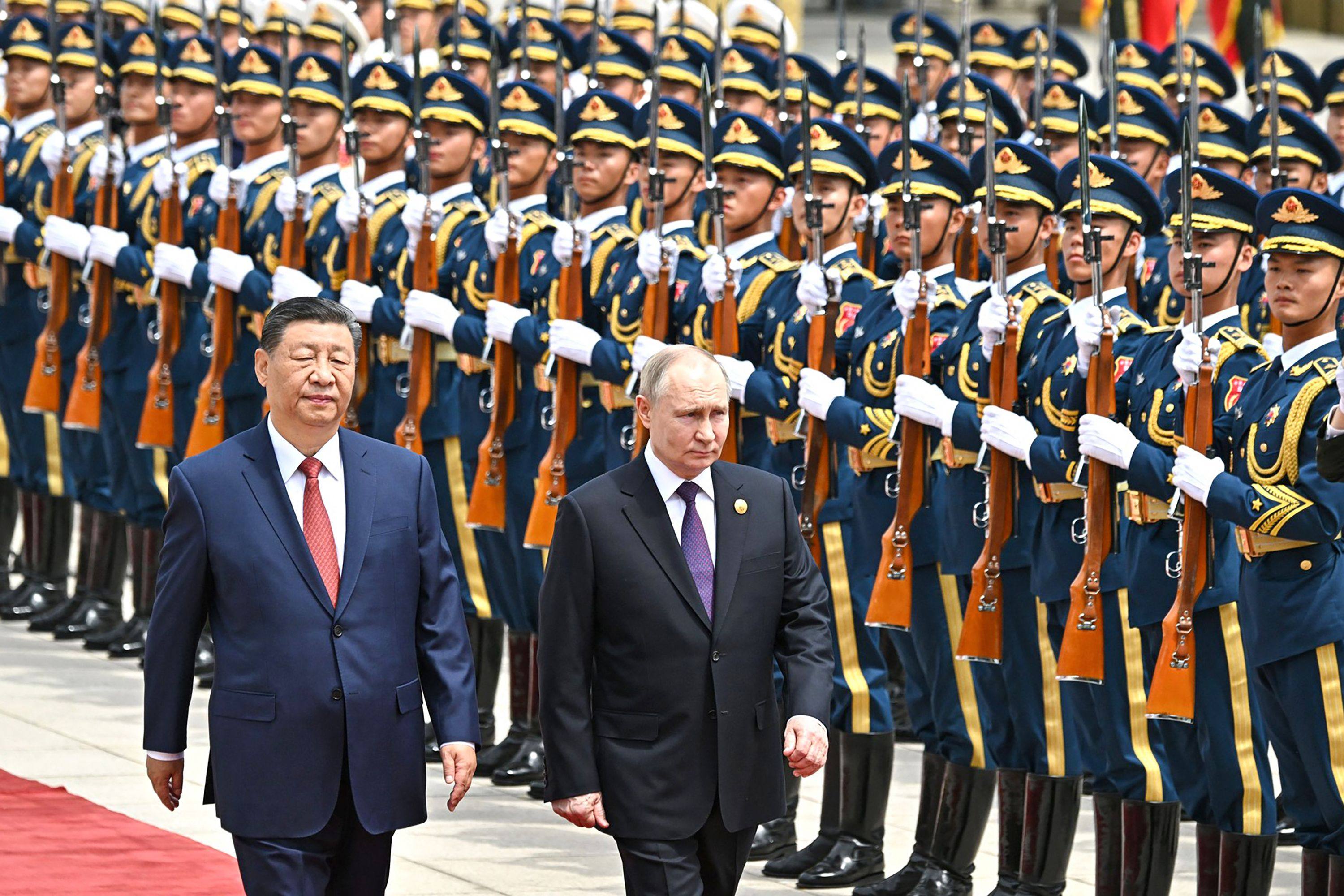 Russian President Vladimir Putin and Chinese President Xi Jinping review a military honour guard during an official welcoming ceremony in Beijing on Thursday. Photo: Russian Presidential Press Office via AFP 