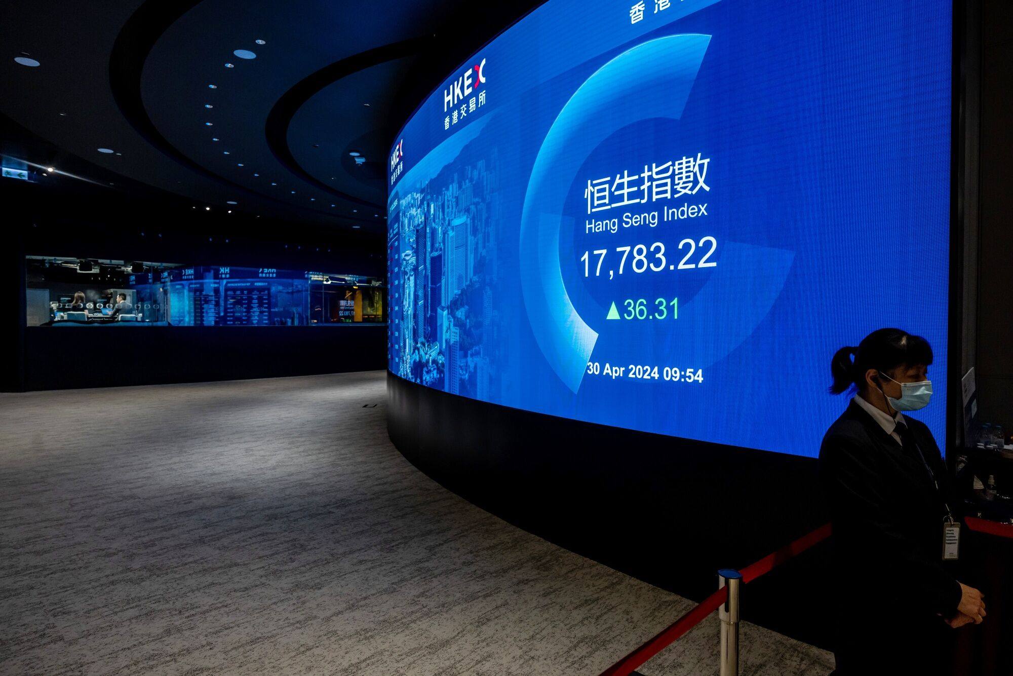 The figures for the Hang Seng Index are seen on a screen at the Hong Kong Stock Exchange on April 30. Photo: Bloomberg