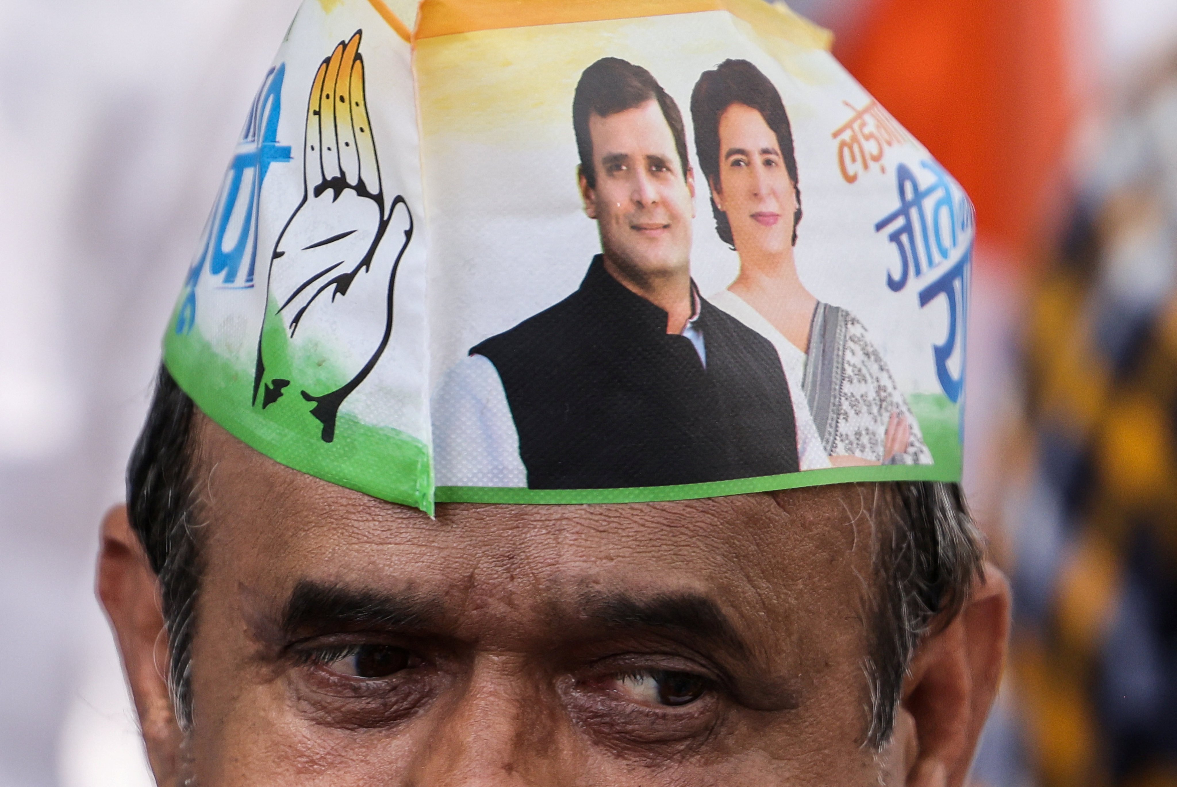 A supporter wears a cap with the picture of Rahul Gandhi, a senior leader of India’s main opposition Congress party, and his sister Priyanka Gandhi Vadra, in Raebareli, India on May 3. Photo: Reuters