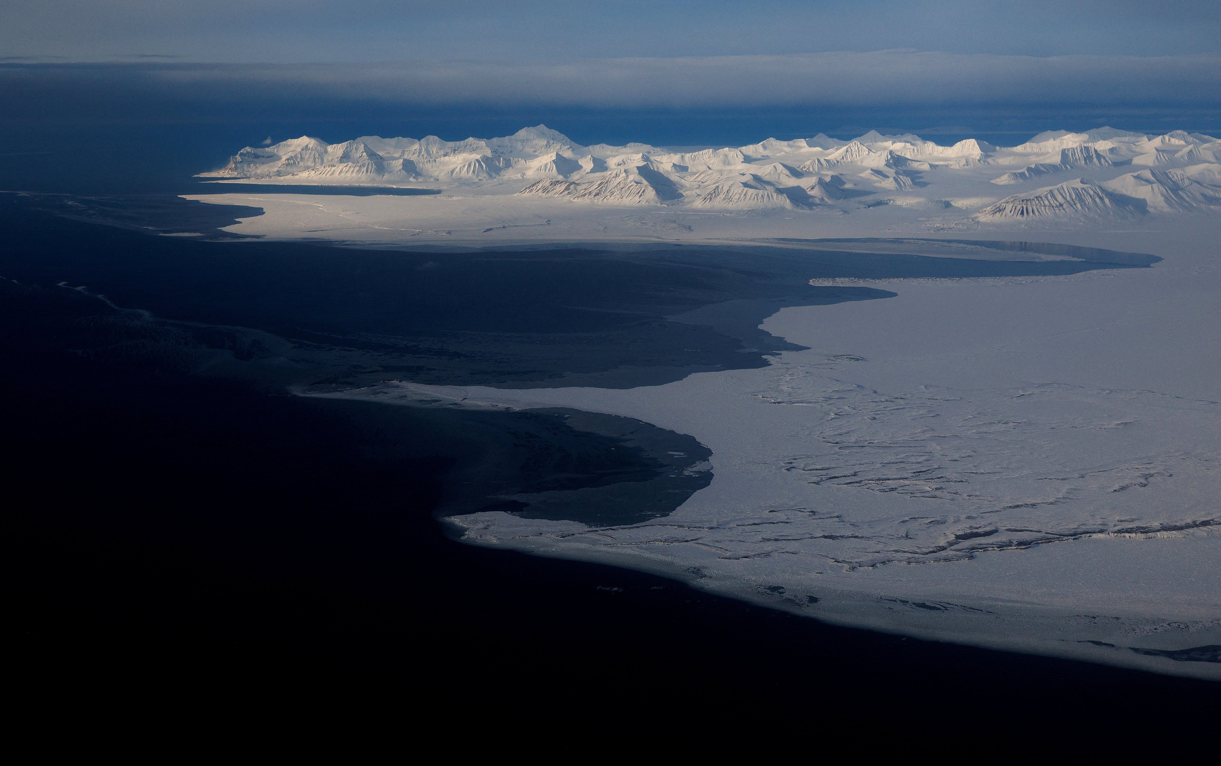 The snowcapped mountains on the coast of Svalbard near Longyearbyen. Photo: Reuters