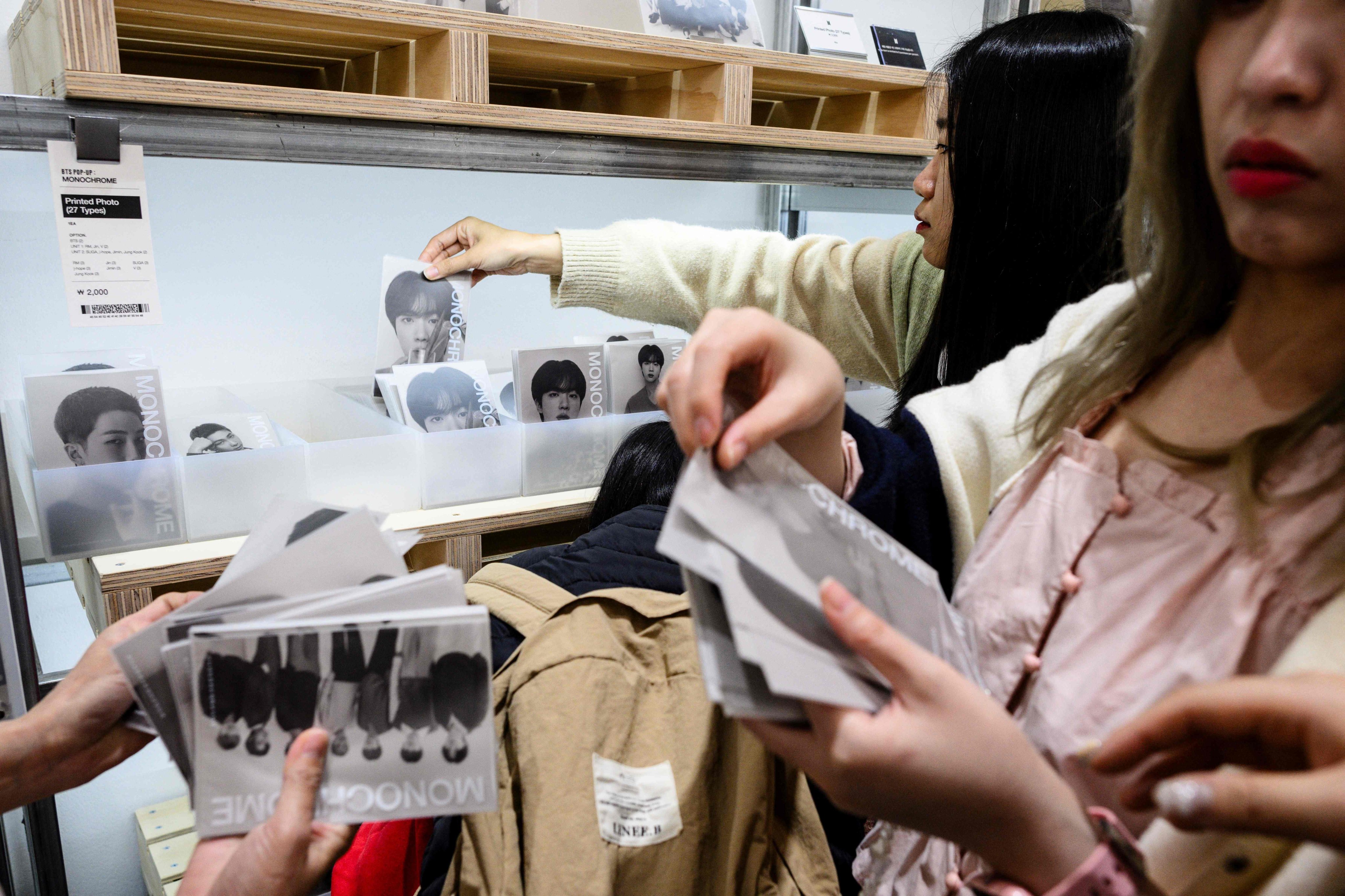 K-pop fans browse merchandise for sale at a BTS pop-up store in Seoul last month. Photo: AFP