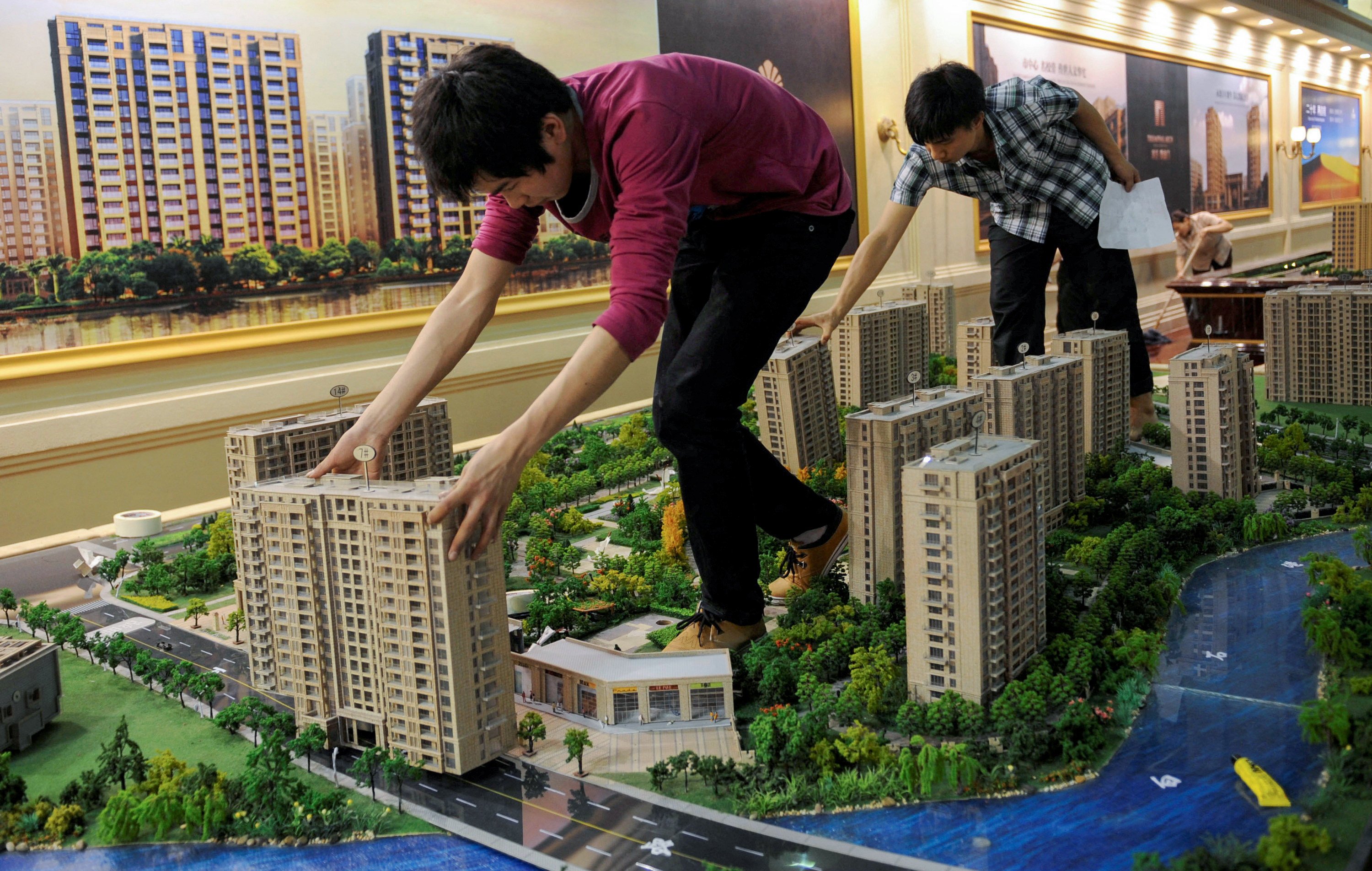 Model flats being set up at a real estate exhibition in eastern China. Beijing has highlighted how a healthy property market is linked to social wellness and economic development. Photo: Reuters