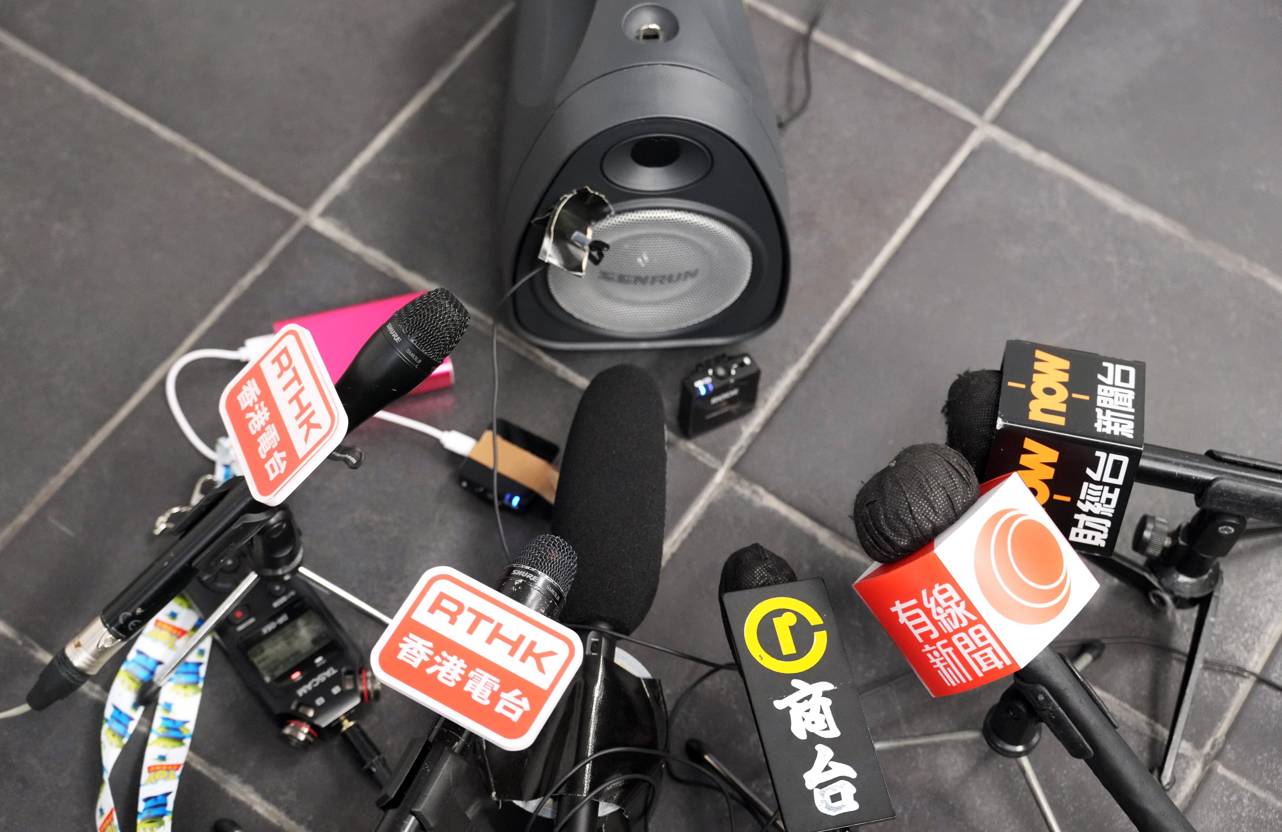 Microphones of different Hong Kong news organisations are placed near a speaker during a press conference at the West Kowloon High Speed Railway Station on April 15, 2024. Photo: May Tse