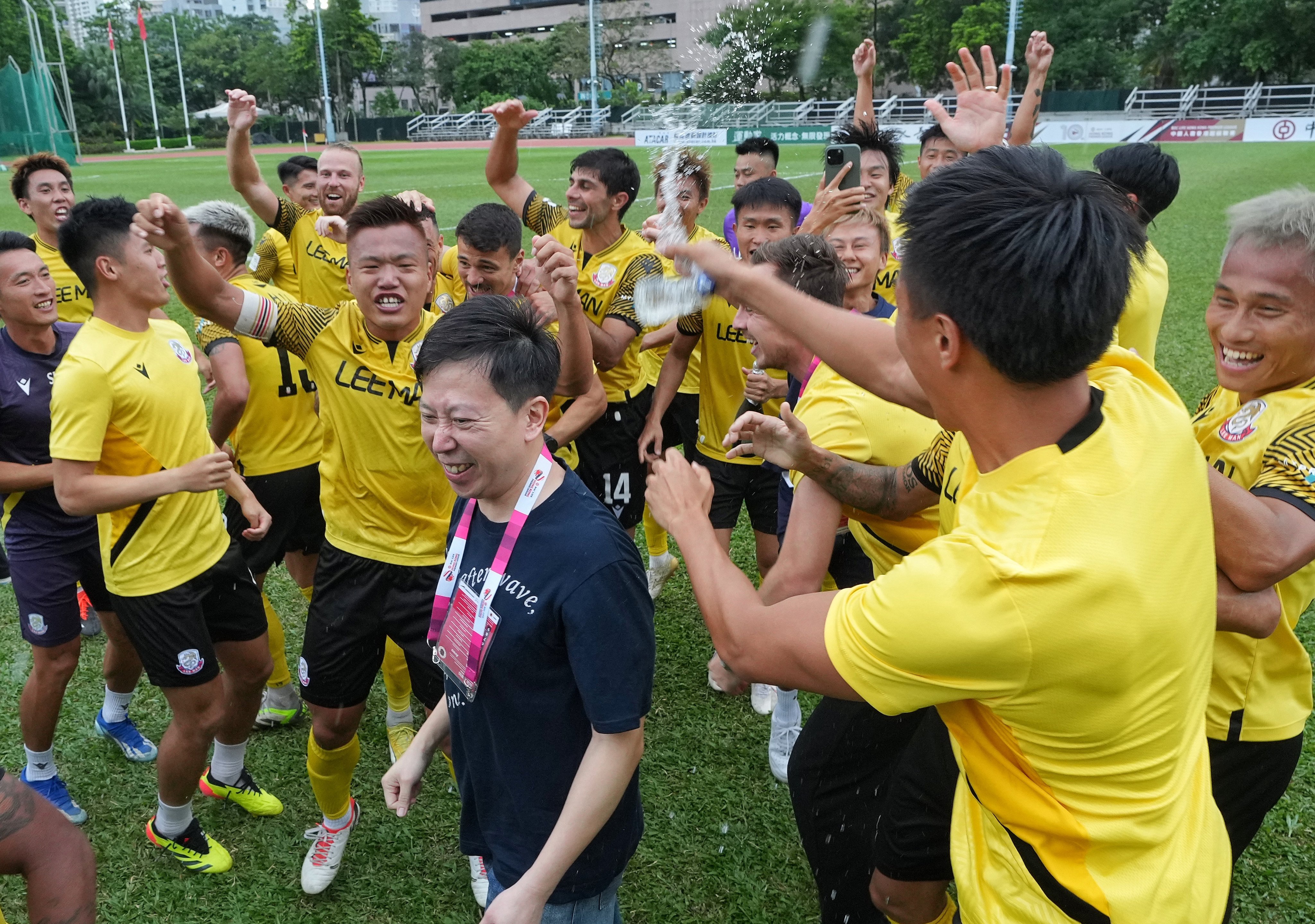 Club president Norman Lee (centre) celebrates winning the Hong Kong Premier League with his players. Photo: Elson Li