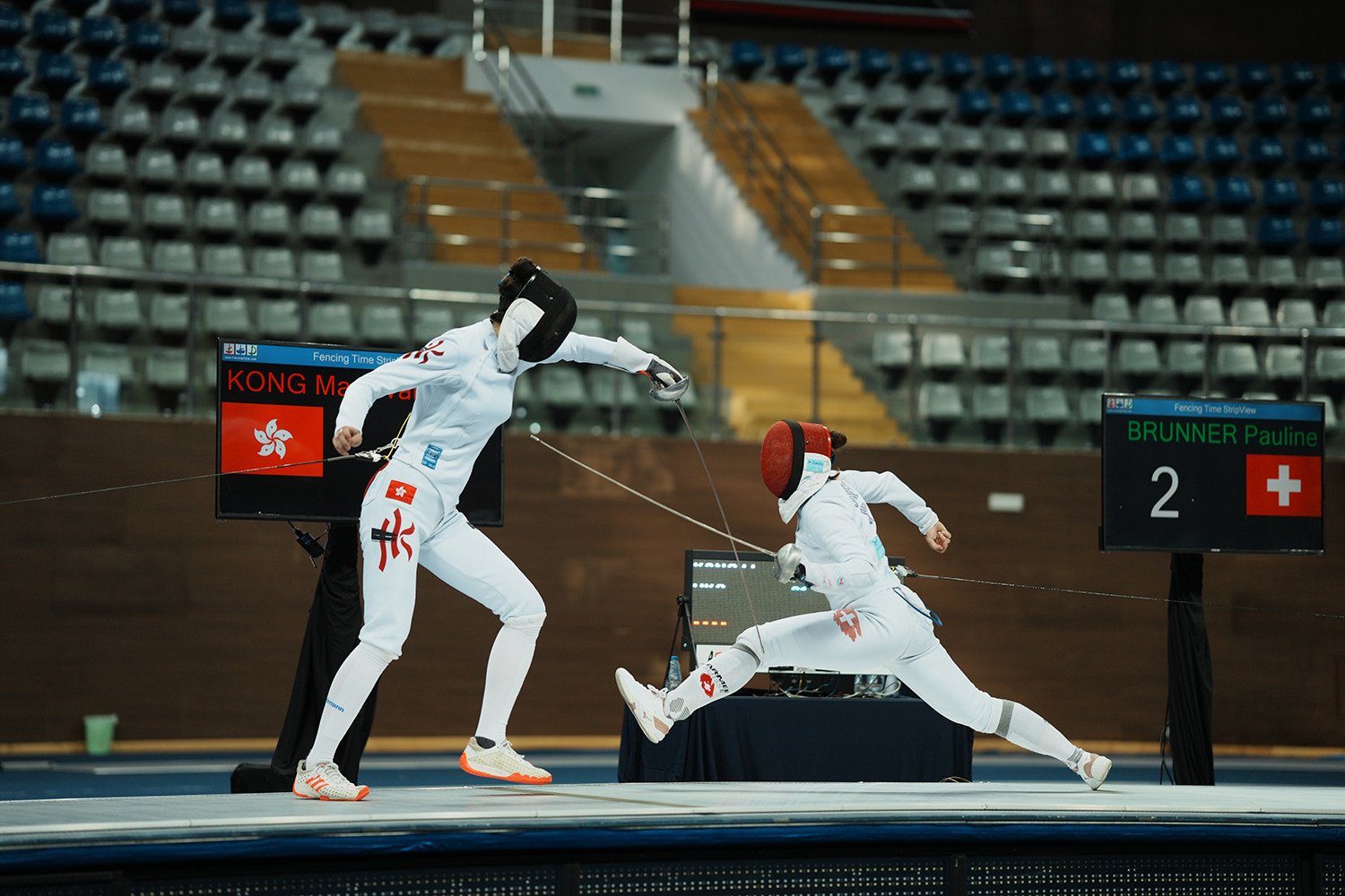 Vivian Kong (left) takes on Pauline Brunner in the final of the women’s epee World Cup event in the United Arab Emirates. Photo: FIE