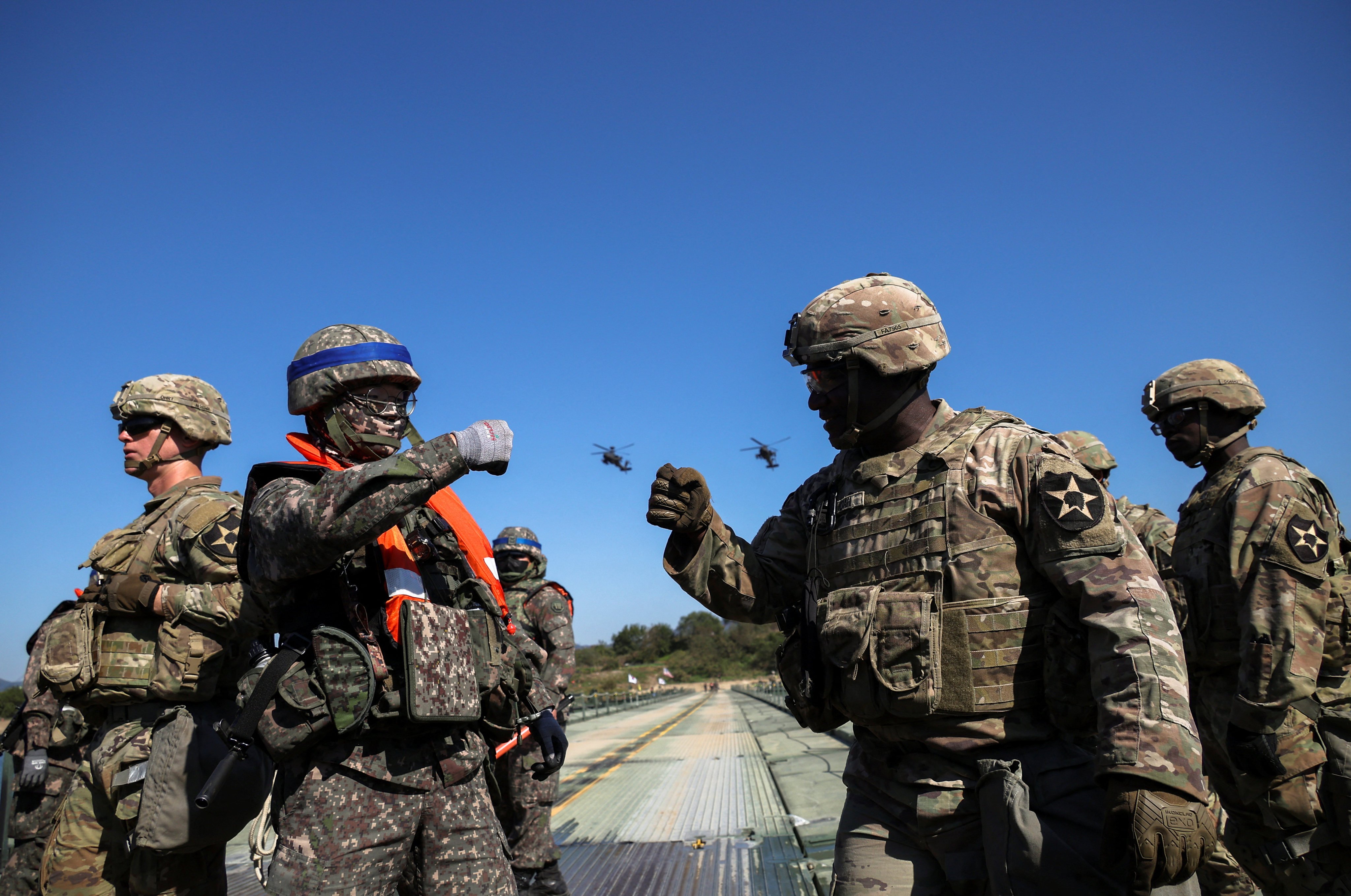 South Korean and US soldiers bump fists as they take part in a military drill in South Korea, in 2022. Photo: Reuters