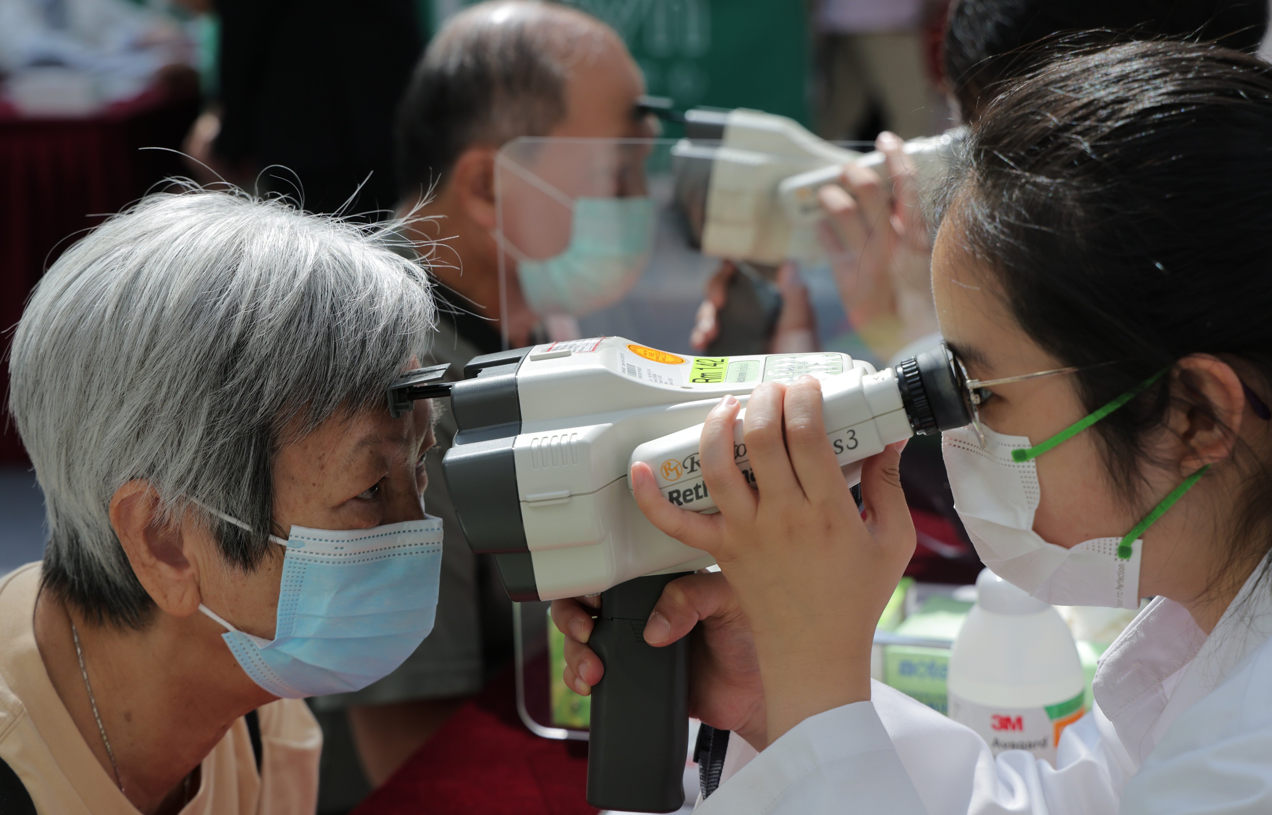 Free eye checks are provided at the “Health In Sight” exhibition organised by the Chinese University of Hong Kong’s Medical Society in Ma On Shan on October 15, 2022. Photo: Jelly Tse