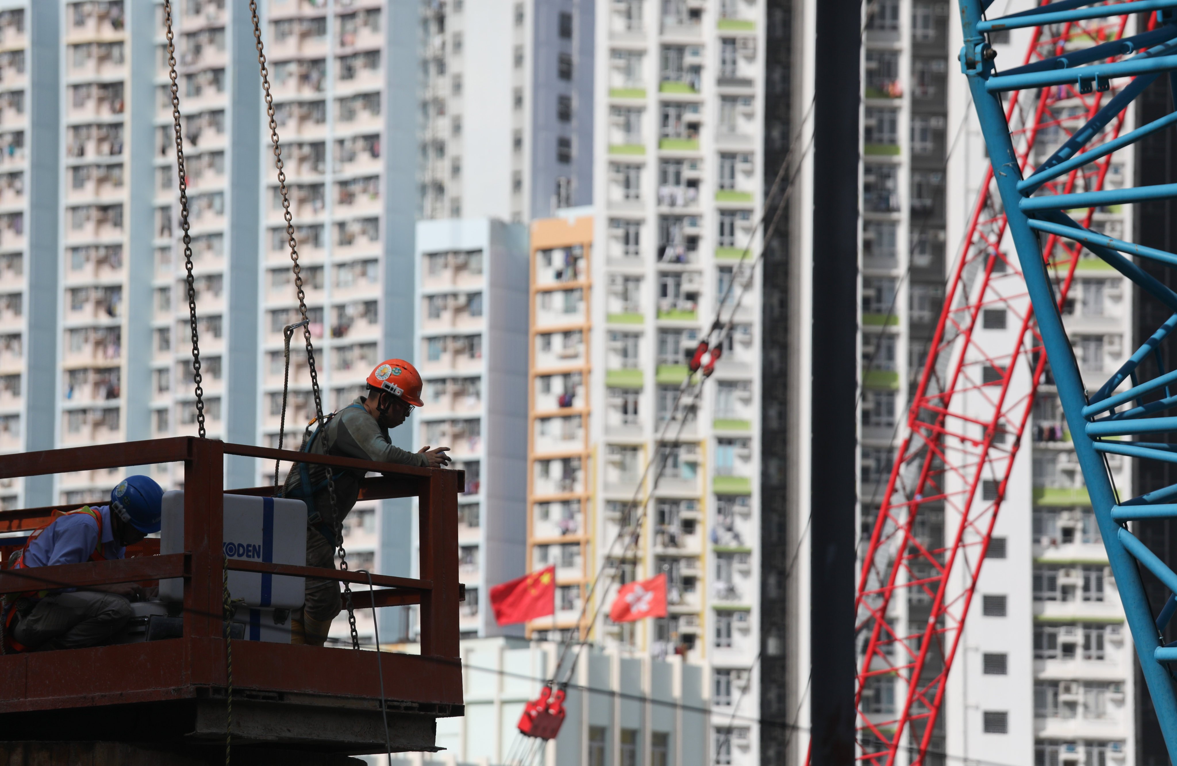 Workers at a public housing construction site in Cheung Sha Wan. Photo: Xiaomei Chen