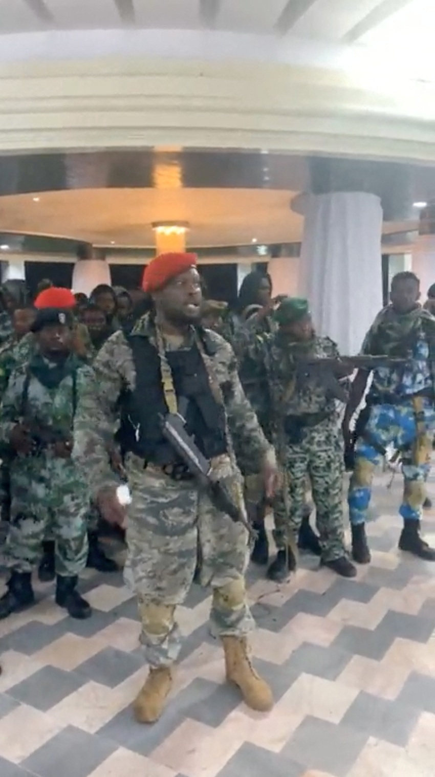 Men in military fatigues inside the Palace of the Nation during an attempted coup in Kinshasa, Democratic Republic of Congo. Photo: Christian Malanga via Reuters