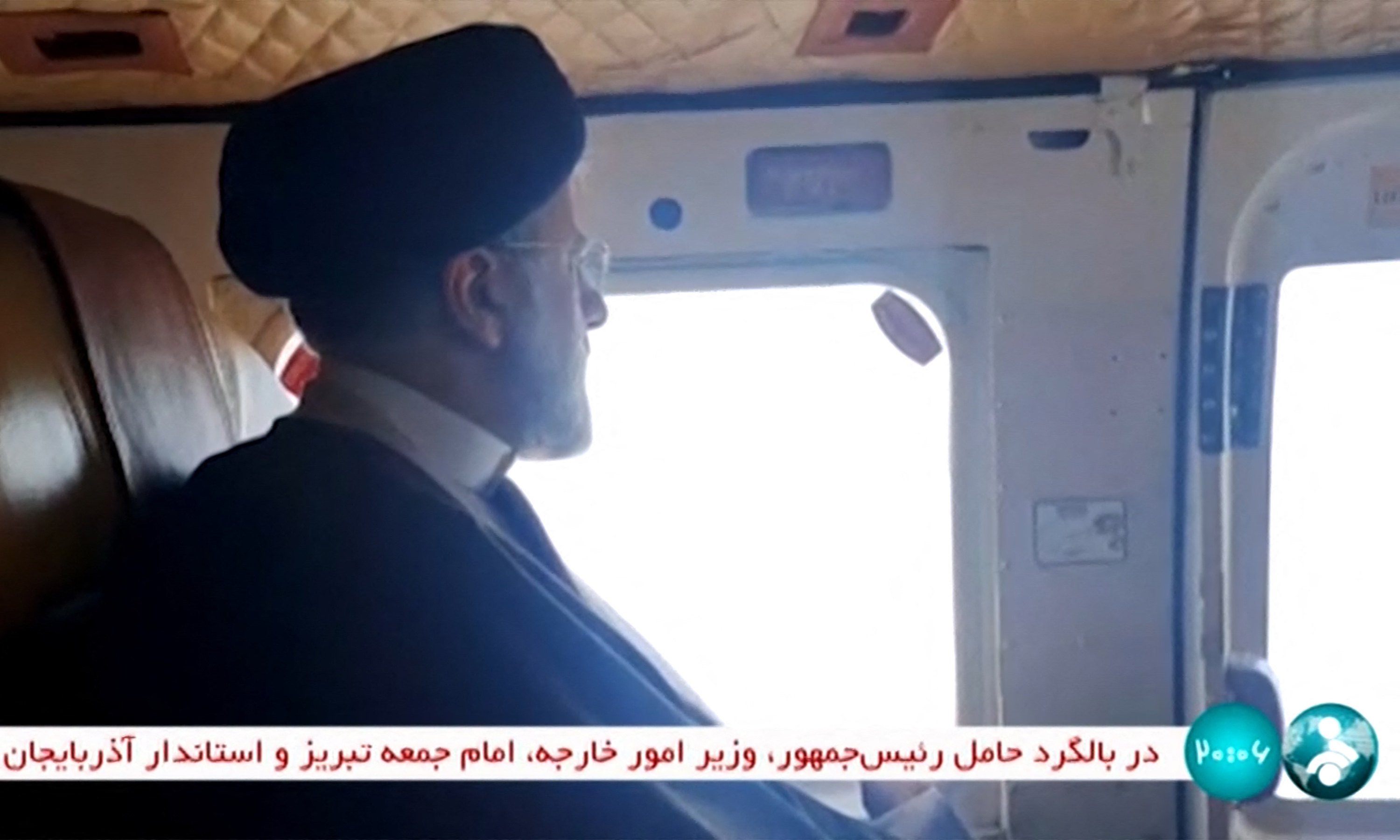 Iran’s President Ebrahim Raisi on board a helicopter on Sunday. Photo: IRINN via AFP
