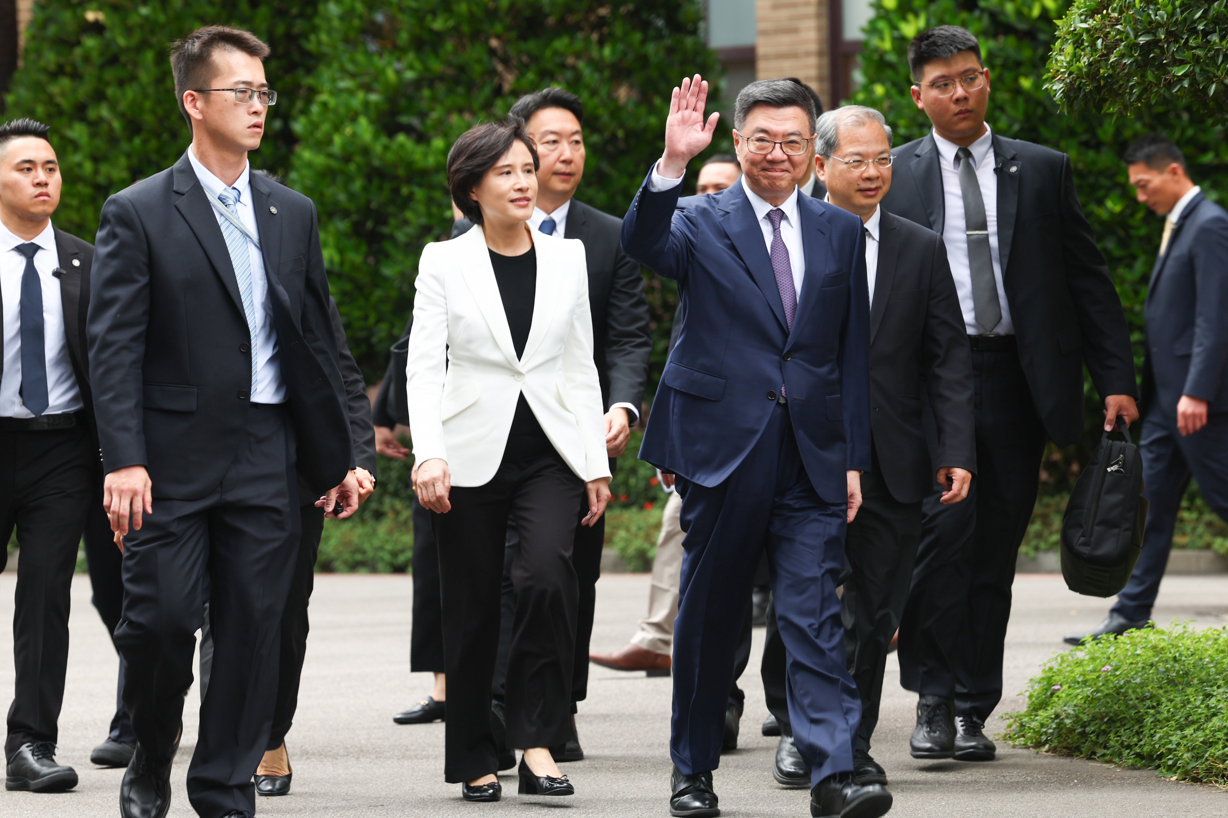 The new cabinet chief Cho Jung-tai (centre, right) and his deputy Cheng Li-chun (centre, left) on their way to the Executive Yuan on Monday. Photo: CNA