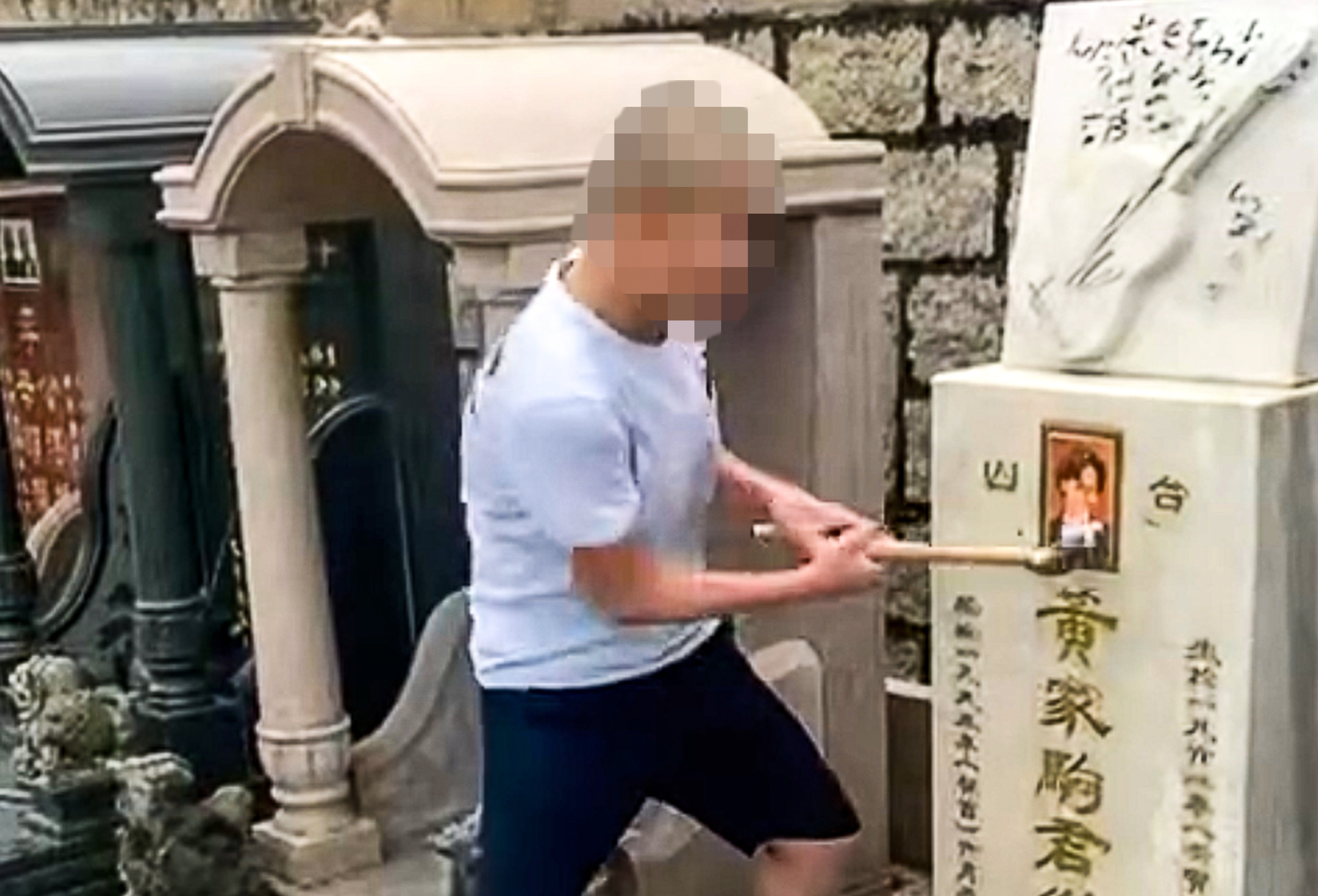 The two videos that went viral on social media last Sunday show the minor and another man vandalising Wong’s grave site. Photo: Facebook