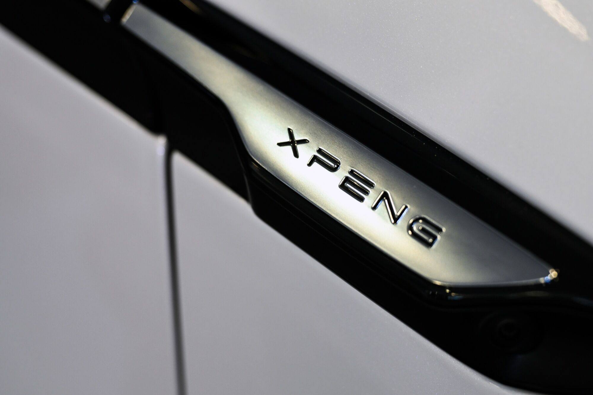 An XPeng logo on its X9 electric vehicle at an event in Hong Kong on May 17, 2024. Photo: Bloomberg