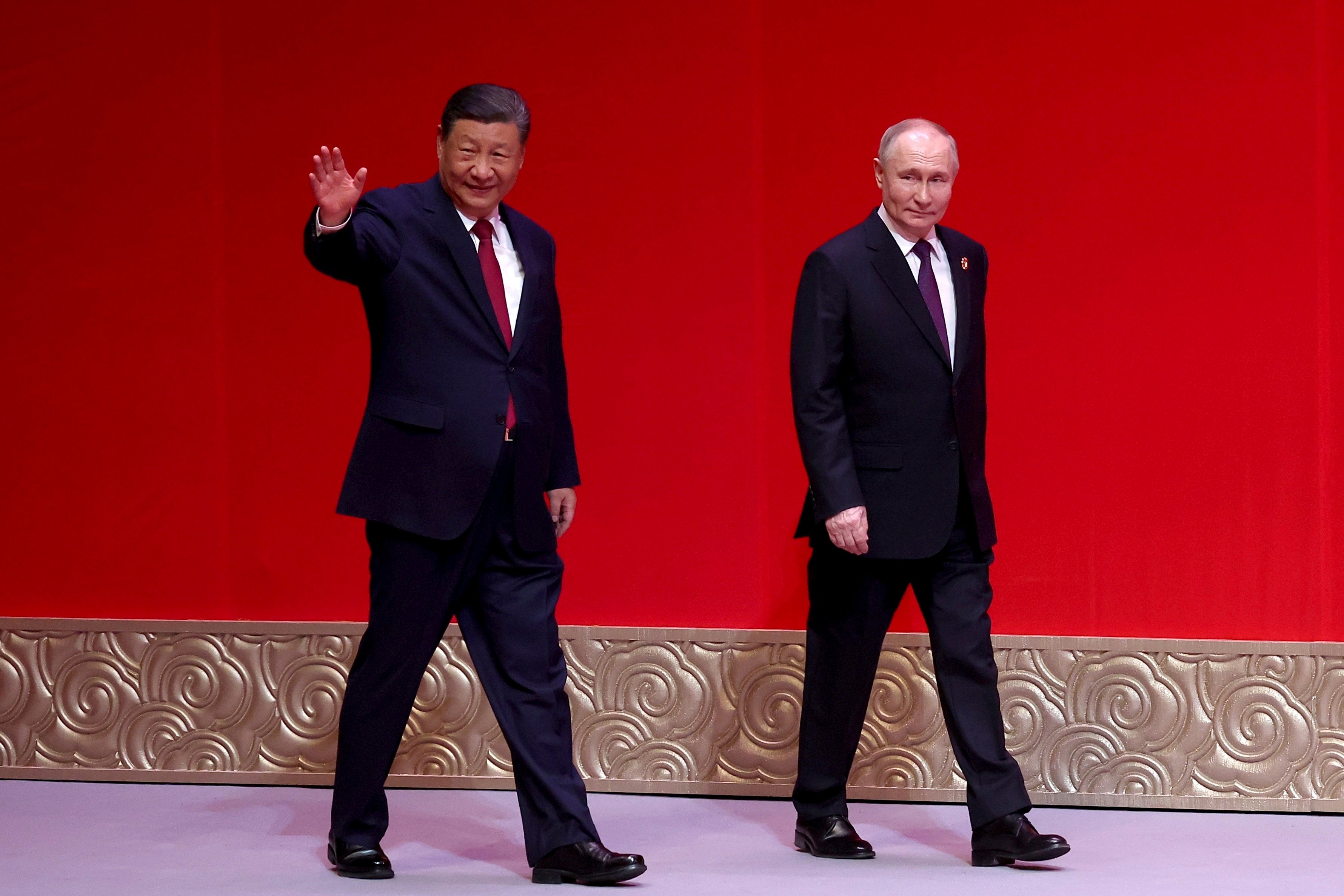 Russian President Vladimir Putin (right) and Chinese President Xi Jinping leave a concert at the National Centre for the Performing Arts in Beijing on Thursday. Photo: AP