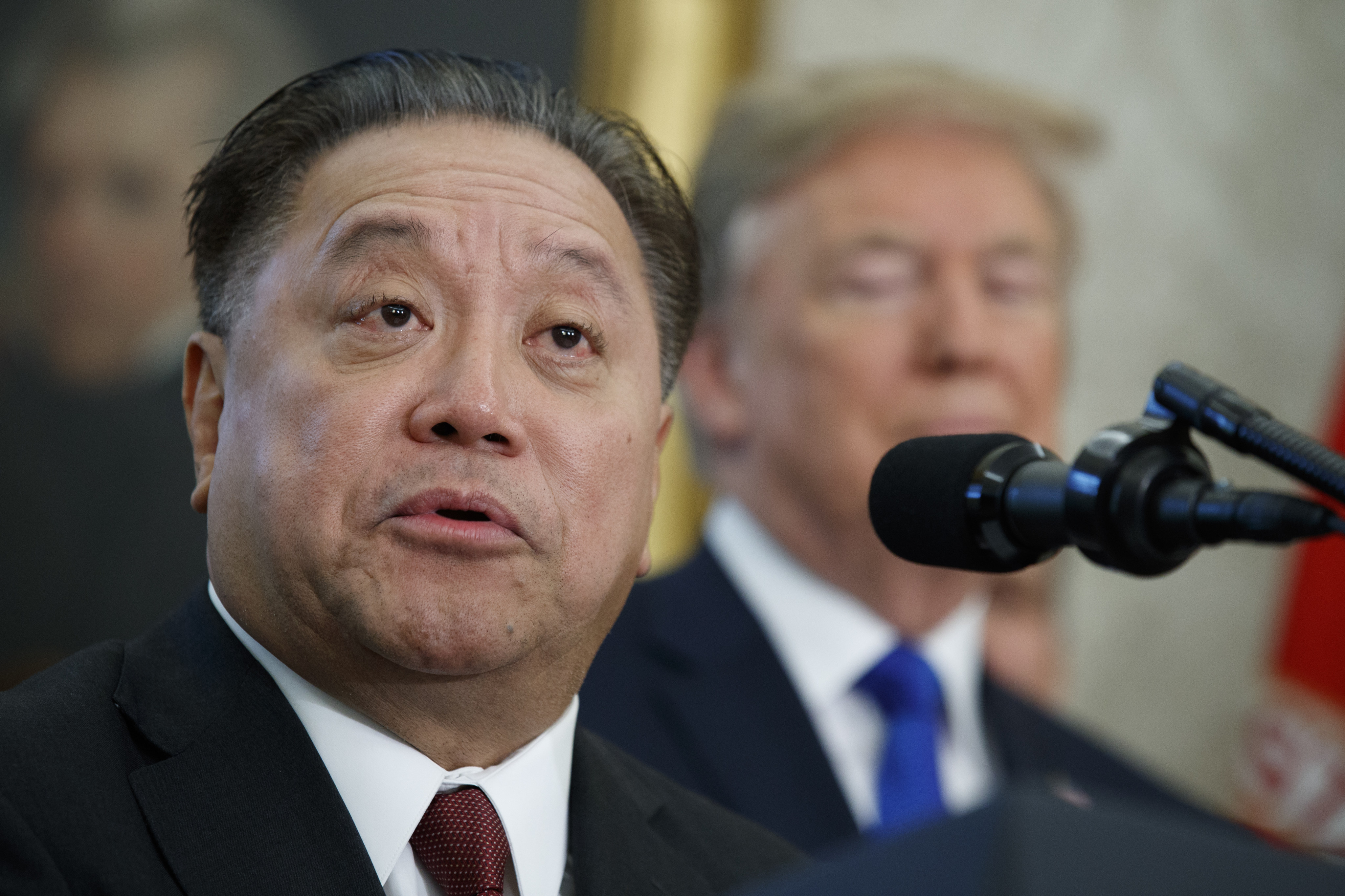Broadcom CEO Hock Tan speaks during an event to announce the company is moving its global headquarters to the United States, in the Oval Office of the White House in November 2017. Photo: AP