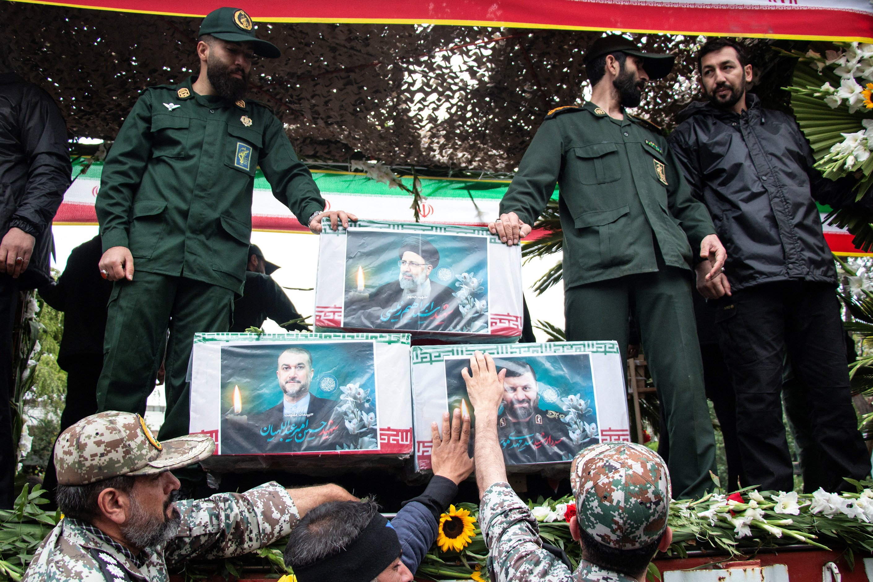A picture of the late Iranian president Ebrahim Raisi is seen on his coffin during a funeral ceremony in Tabriz, Iran. Photo: West Asia News Agency via Reuters