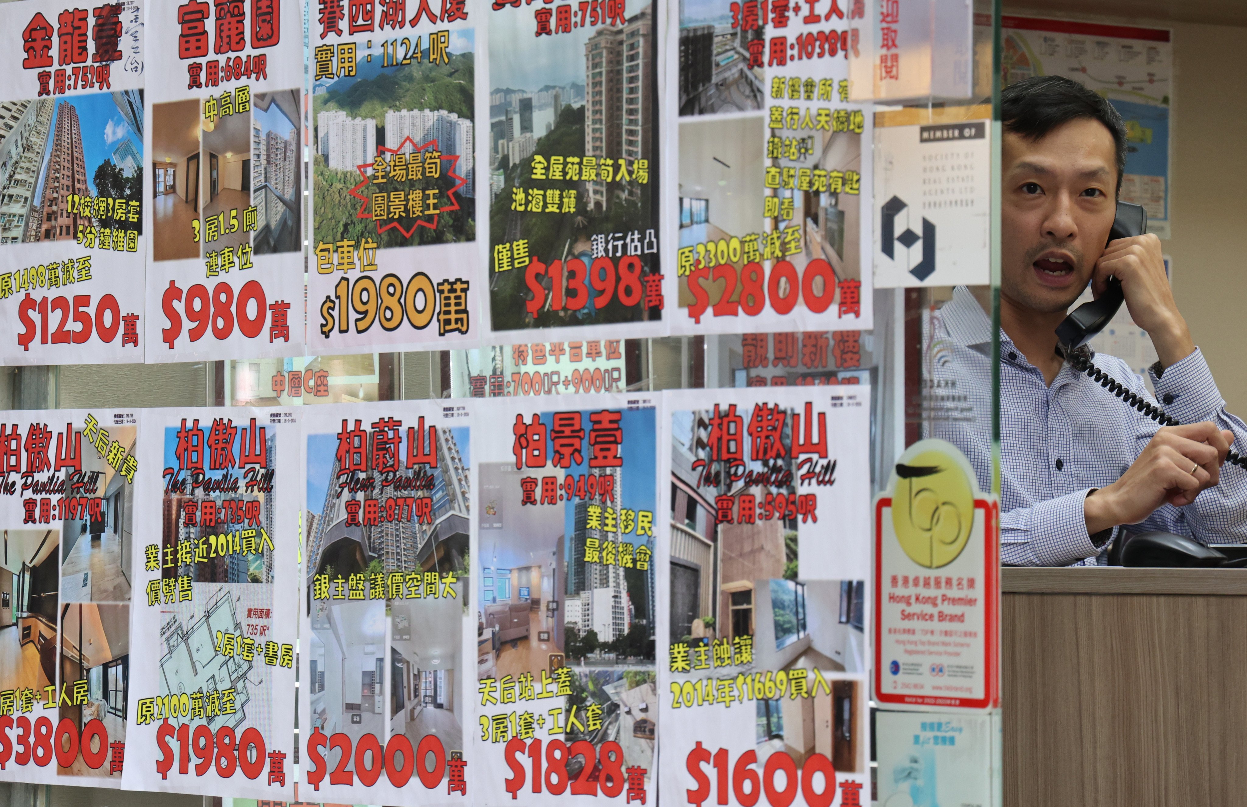 An estate agent working in an agency in Tin Hau, Hong Kong in April 2024. Photo: Jelly Tse