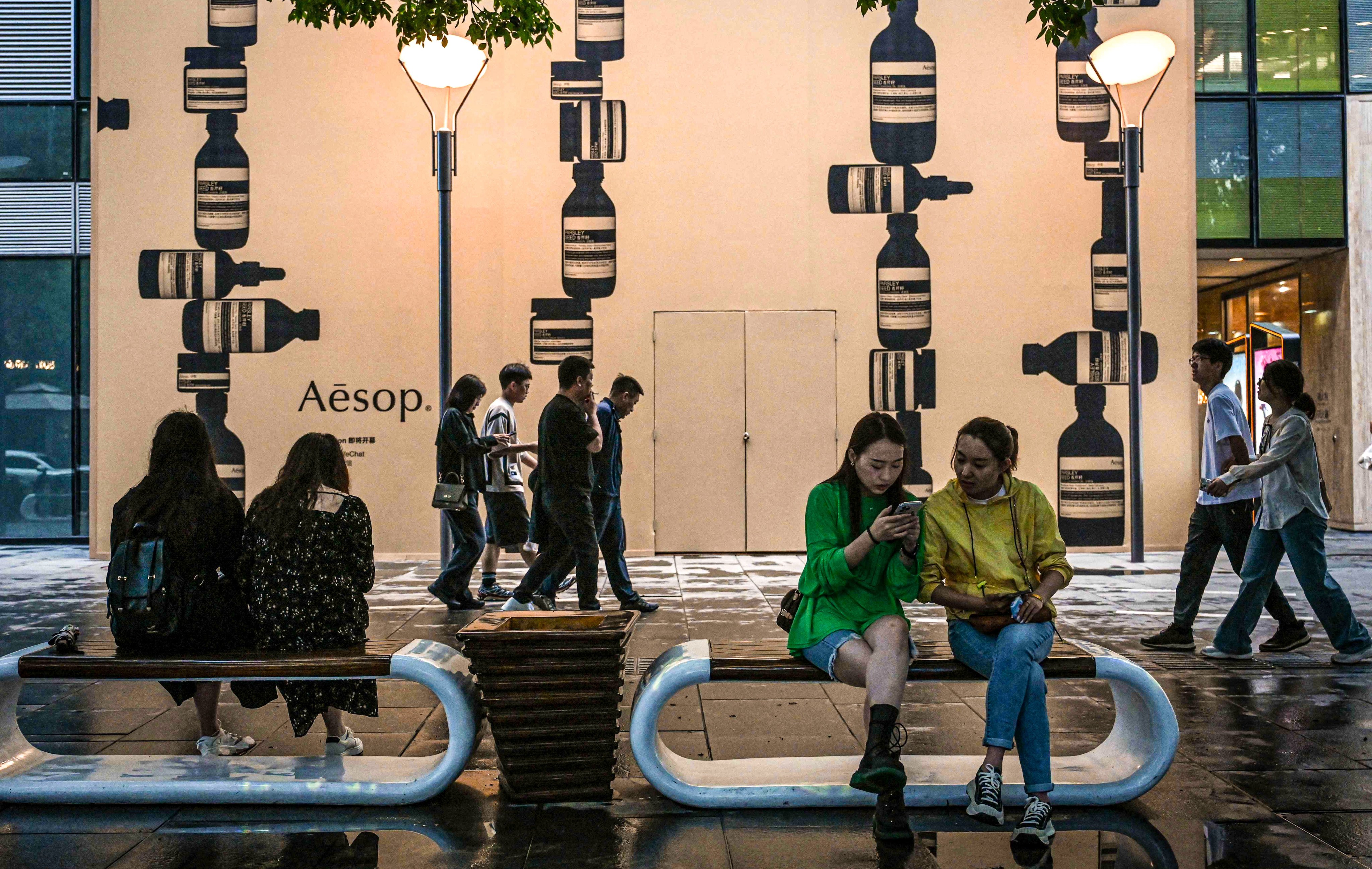 Shoppers visit a mall complex in Beijing on May 10, 2024. Photo: AFP